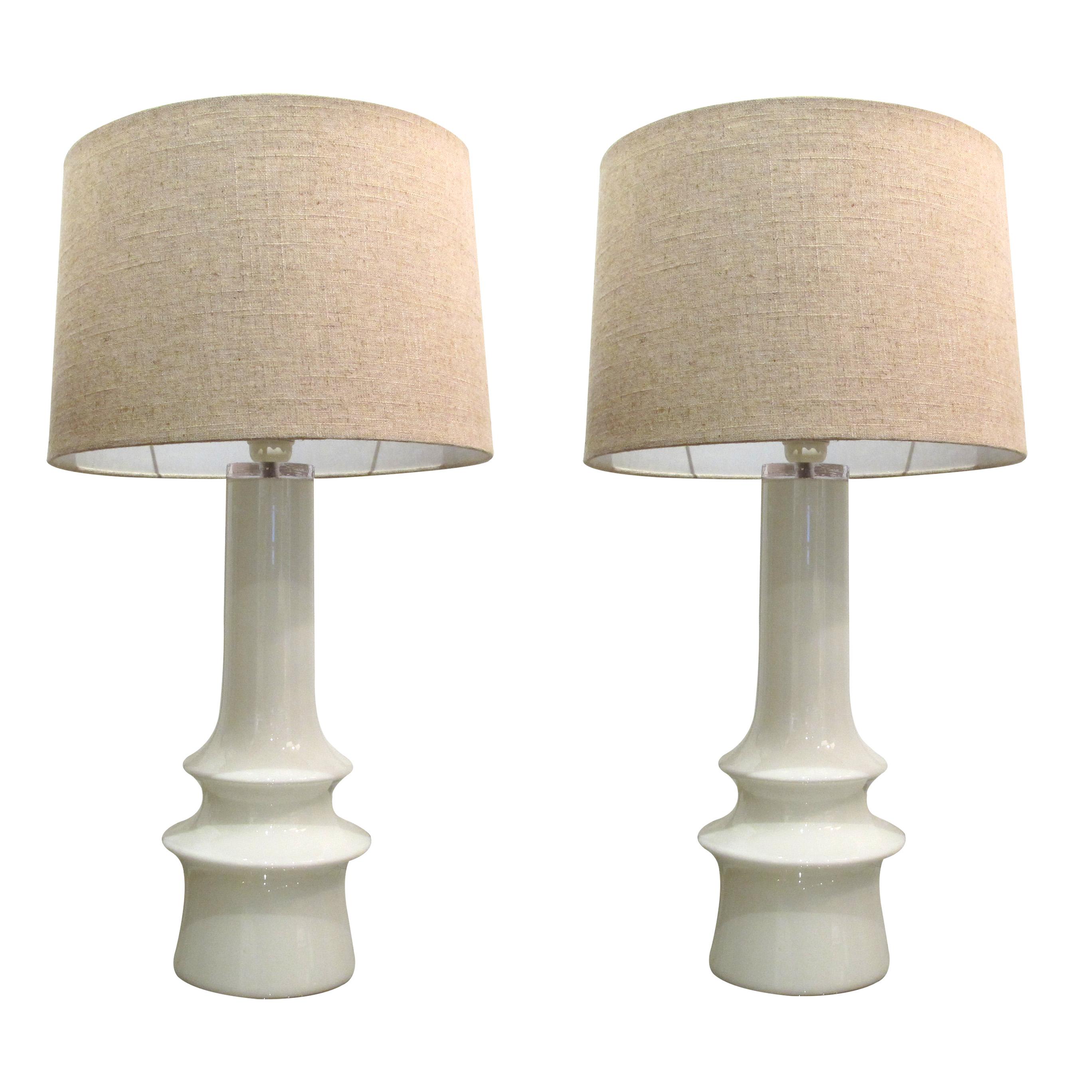 Pair of very elegant large hand blown, white opaline glass table lamps, Swedish 1960s manufactured by Bergboms in Sweden. The lamps are highly decorative and will fit in any style of interior. The lamps have been rewired to the UK standard.

Size: