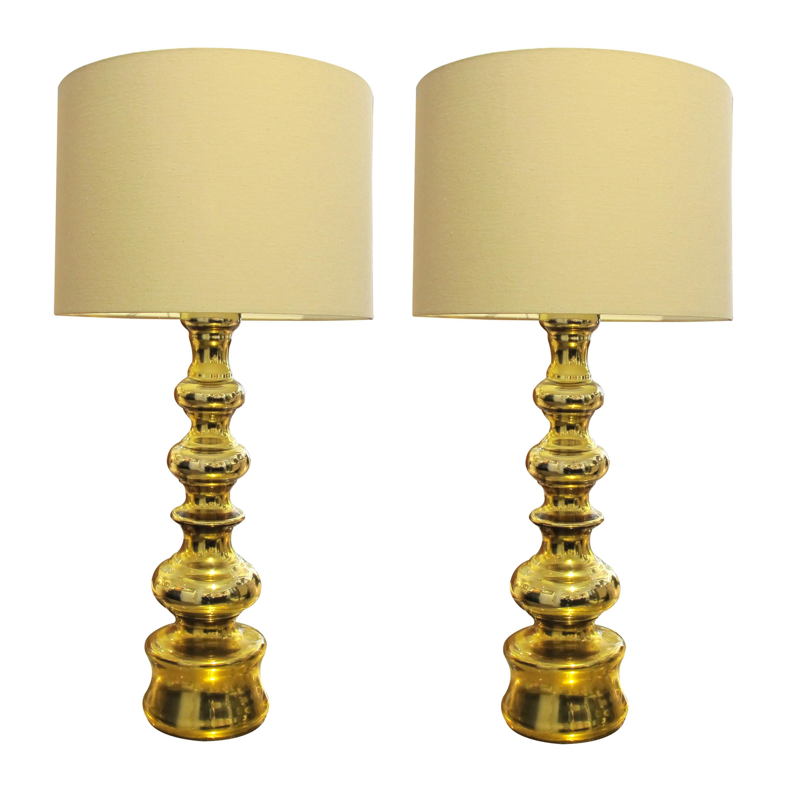 A pair of very elegant large gold glass table lamps, manufactured in Sweden in the 1970s. The lamps will be a great addition to any type of interior. The lamps have been rewired to the UK standard.

Size without the shades: H63 cm x Diameter 17 cm