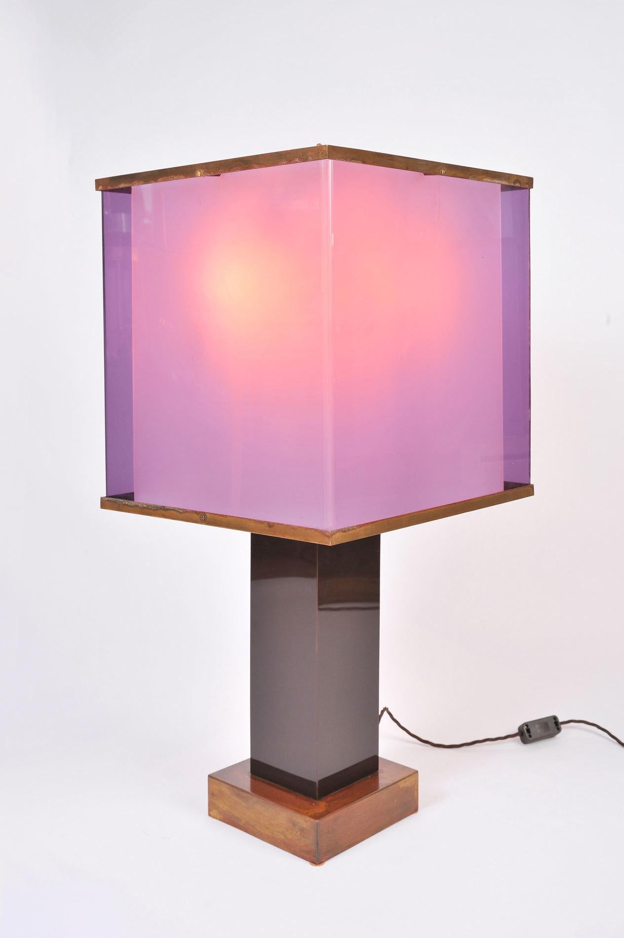 Large Modernist table lamps designed by Romeo Rega. Two-tones of purple double Lucite shades with brass trim supported by black Lucite columns on square brass bases.

Measures: 80cm tall x 41cm square (each).