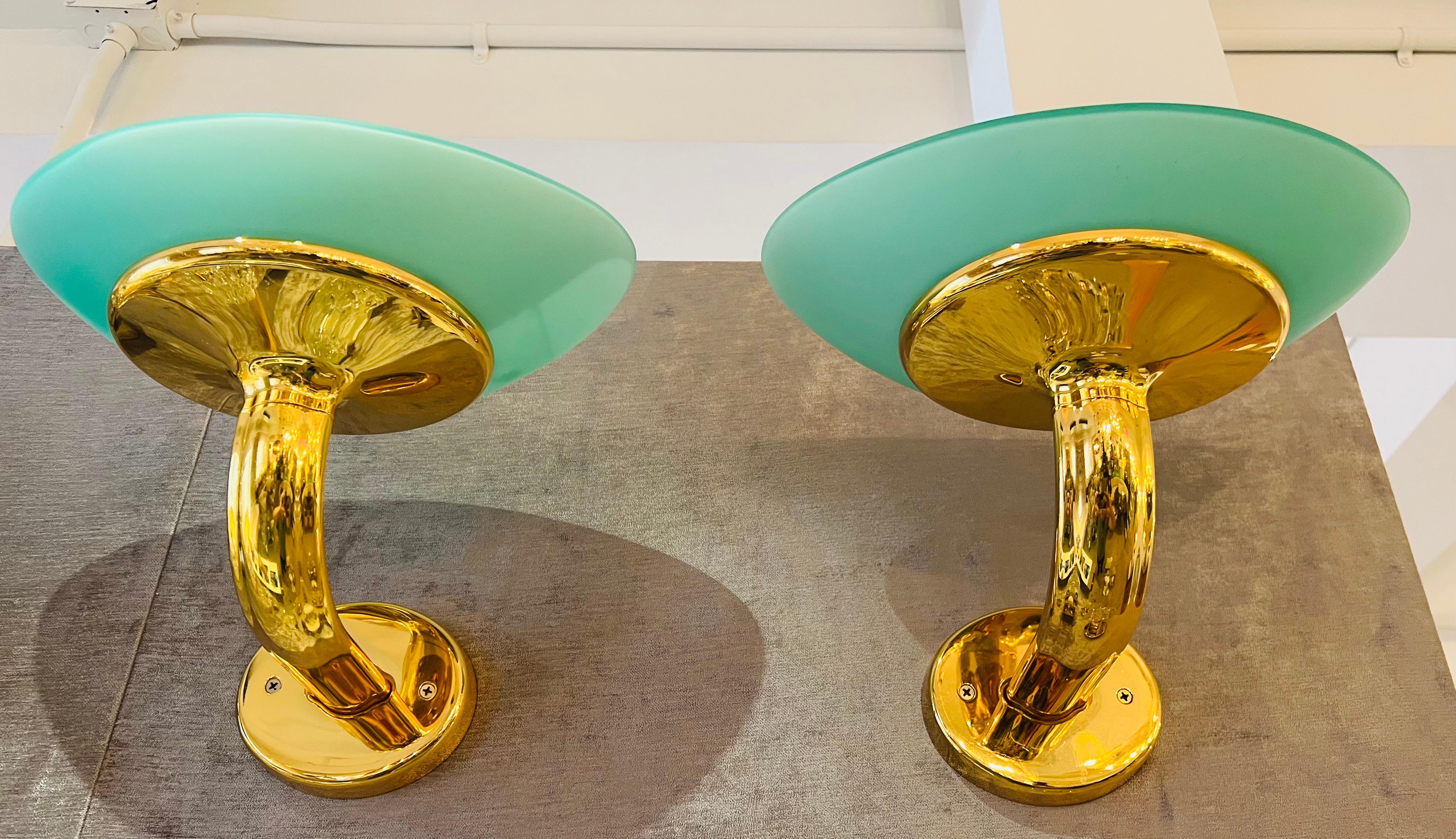 A pair of large gold plated luxurious 1980s wall lamps with green sea foam elliptical glass shades by Fratelli Martini. Great condition. Rewired.