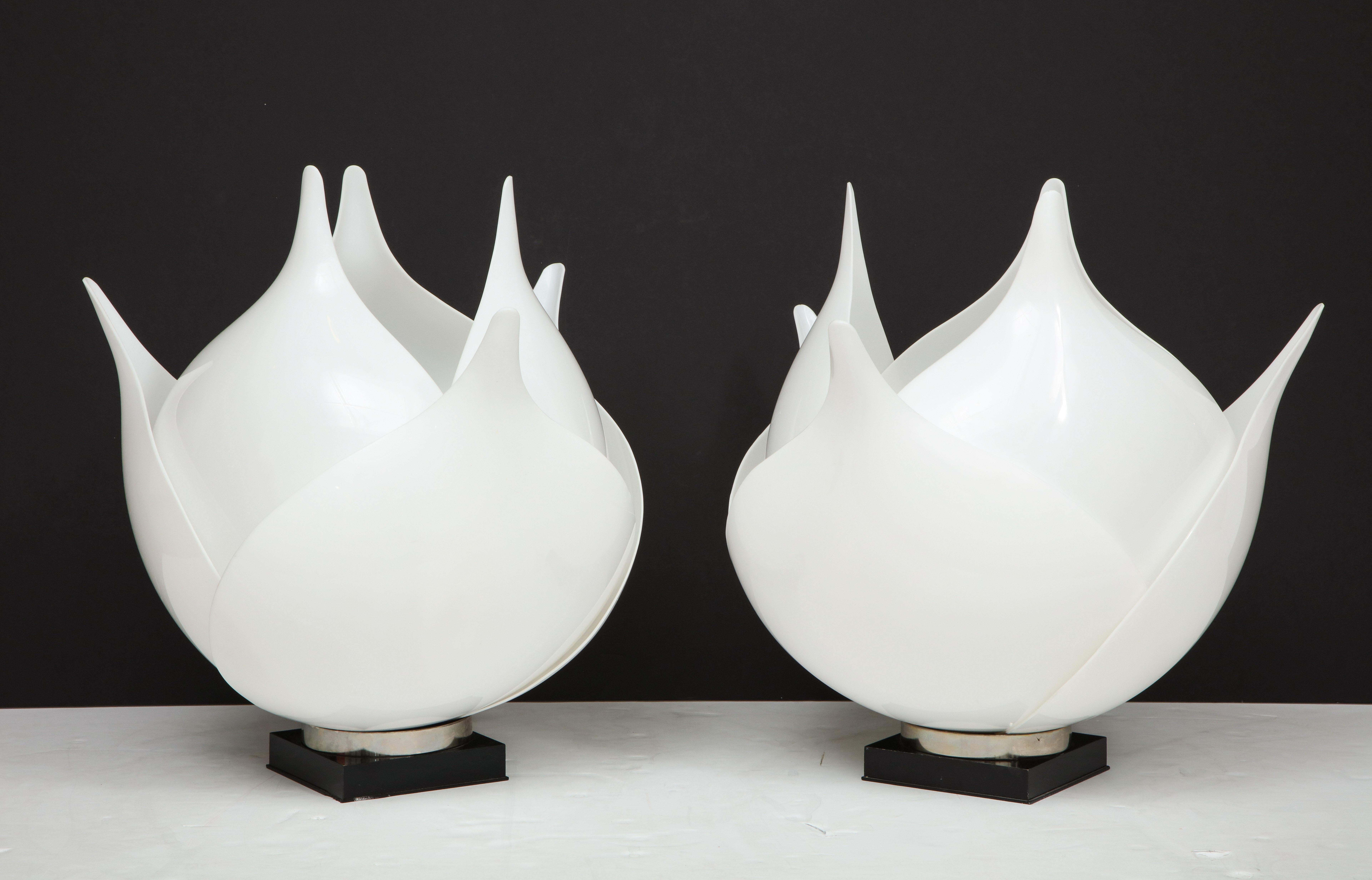 A stunning large pair of 1980s acrylic lamps by Rougier.
The lamps have 6 large petals which resemble Artichoke leaves and they
have been newly rewired.
There are a couple of minimal repairs which are not noticeable on the inner petal.
