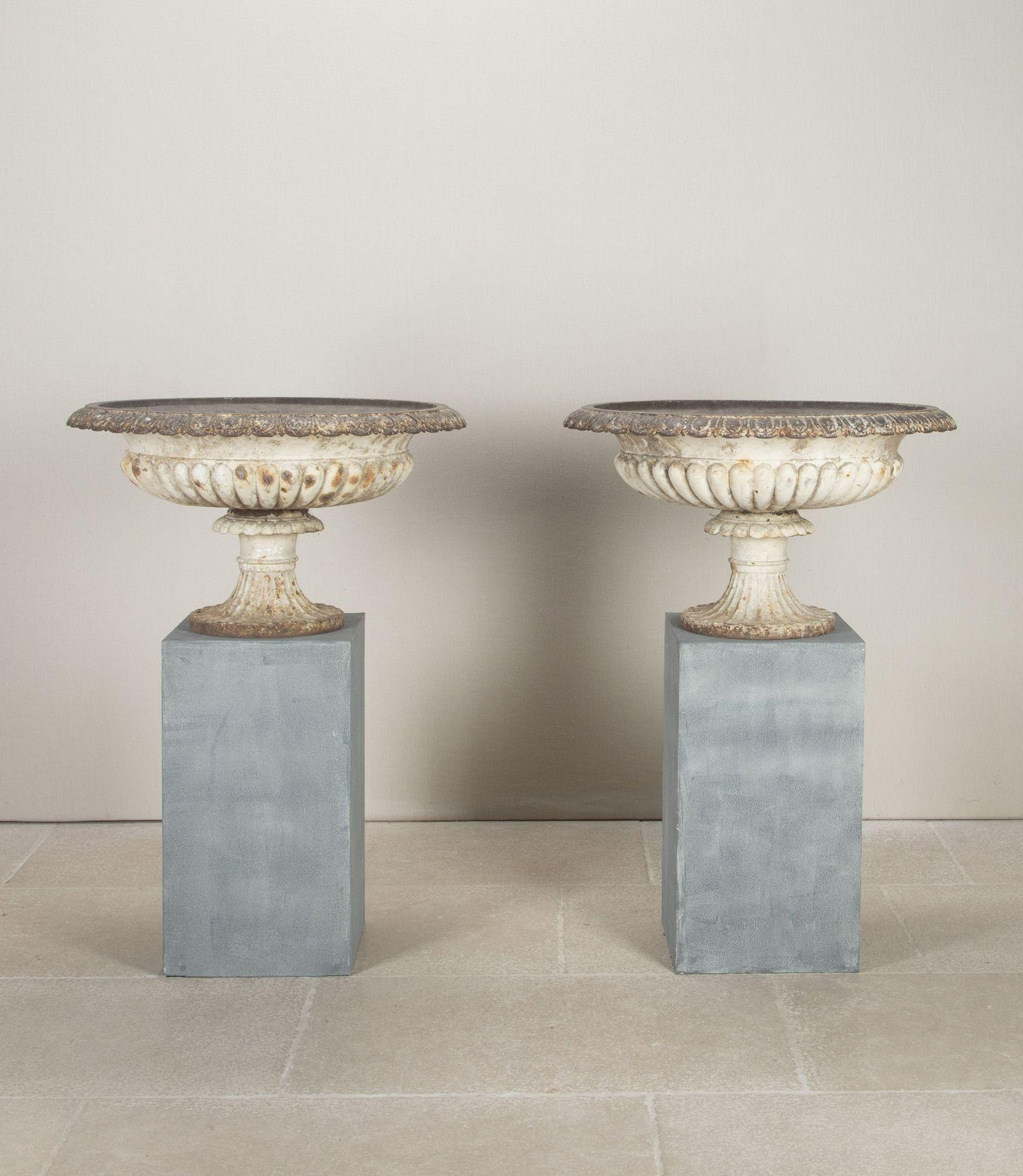 Large pair of late 19th Century English impressive cast iron urns, retaining the original paint. This size is not often seen definite statement pieces for the garden. Circa 1890.