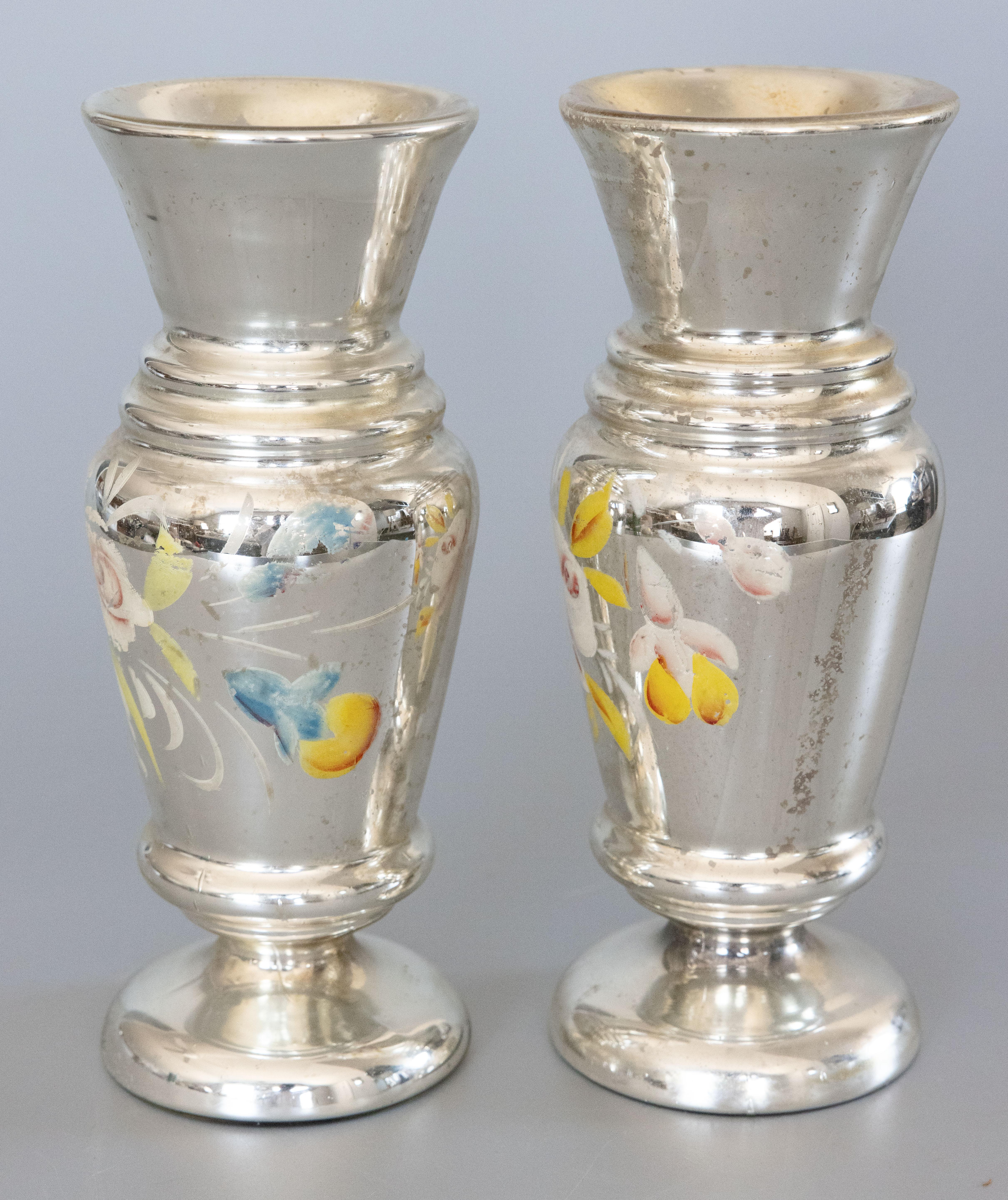 A lovely large pair of authentic antique 19th-Century hand blown mercury glass decorative vases from England. These stunning vases have stylish shapes with hand painted floral designs in a beautiful patina and would be the perfect room accent