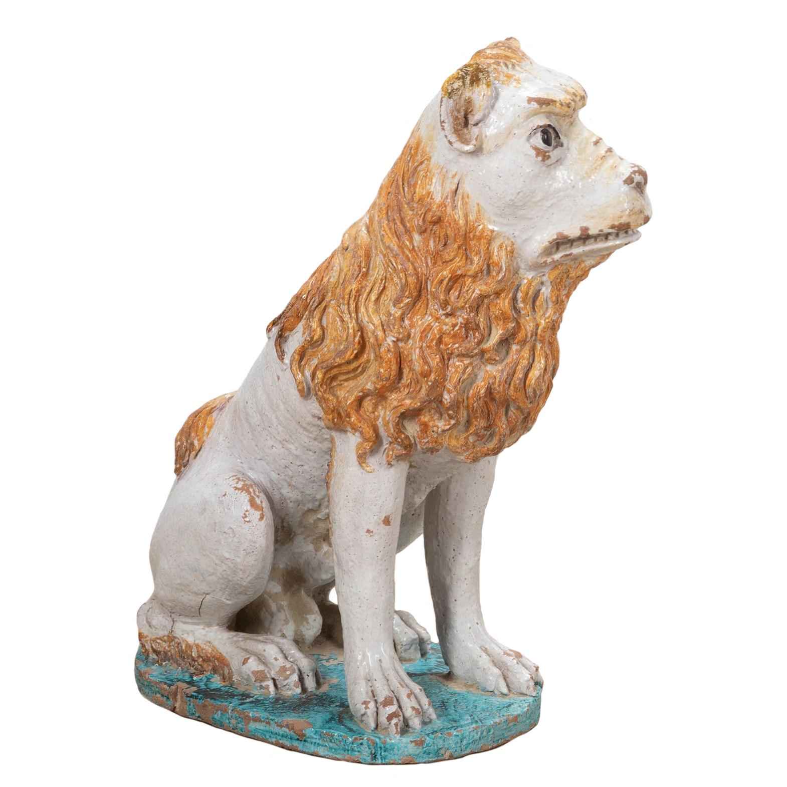 Large pair of French 19th Century polychrome Rouen Faience lions with wonderfully expressive faces and flowing manes. 

Their glazed bodies sitting on a vibrant turquoise base. Various age-related minor chips and overall rubbing to the glaze. 

A