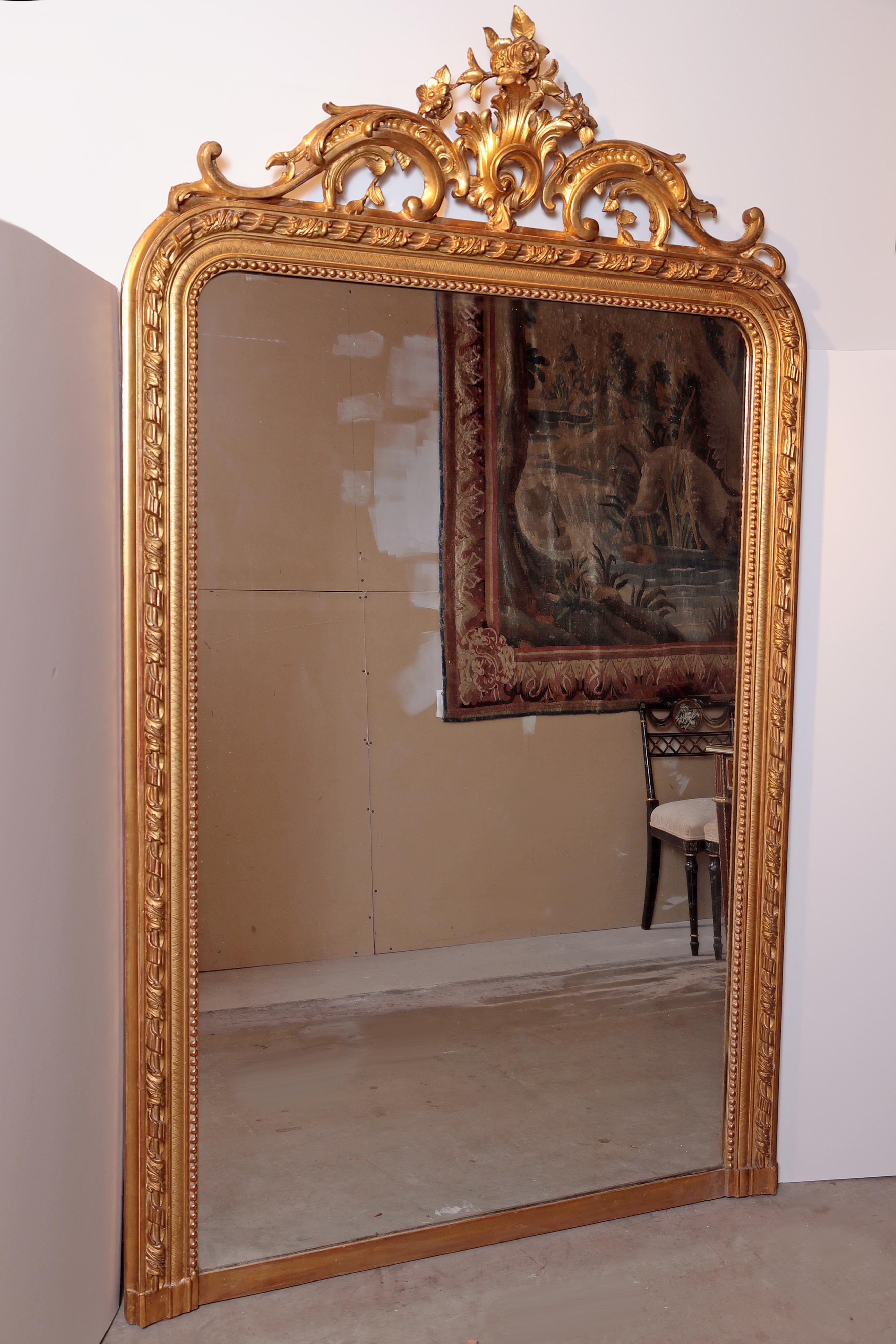 Pair of French Louis XV gilt carved large mirrors. Finely carved scroll design.