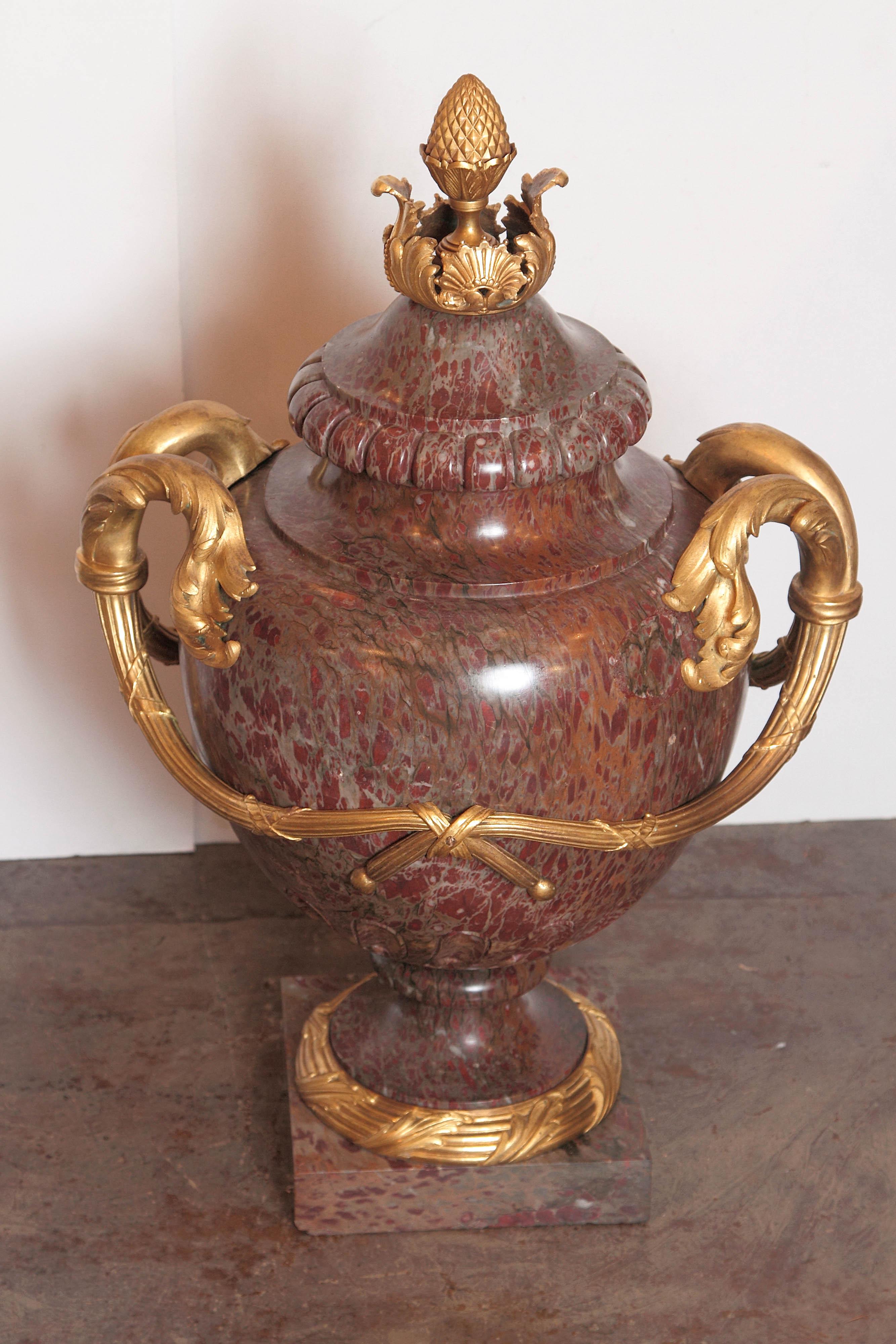 Pair of large French 19th century marble and gilt bronze lidded urns.