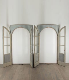 Pair of Large 19th Century French Oak Door Frames with Curved Glass Doors