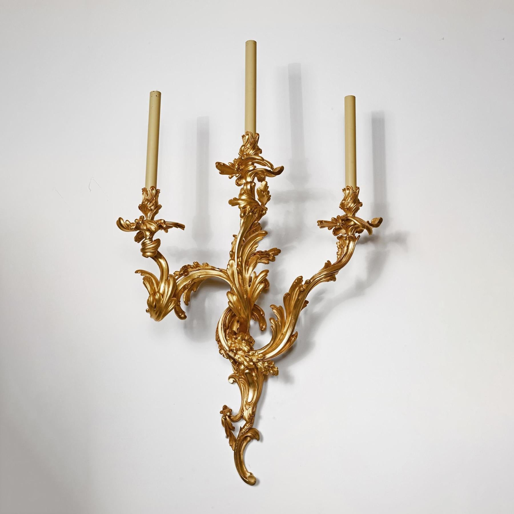 An exceptional pair of grand scale 19th century French gilt bronze wall lights after the Rococo Model by Jean-Claude Duplessis of c.1749.

French - Paris Circa 1880
 
These outstanding wall lights of wonderful scale and colour with asymmetric
