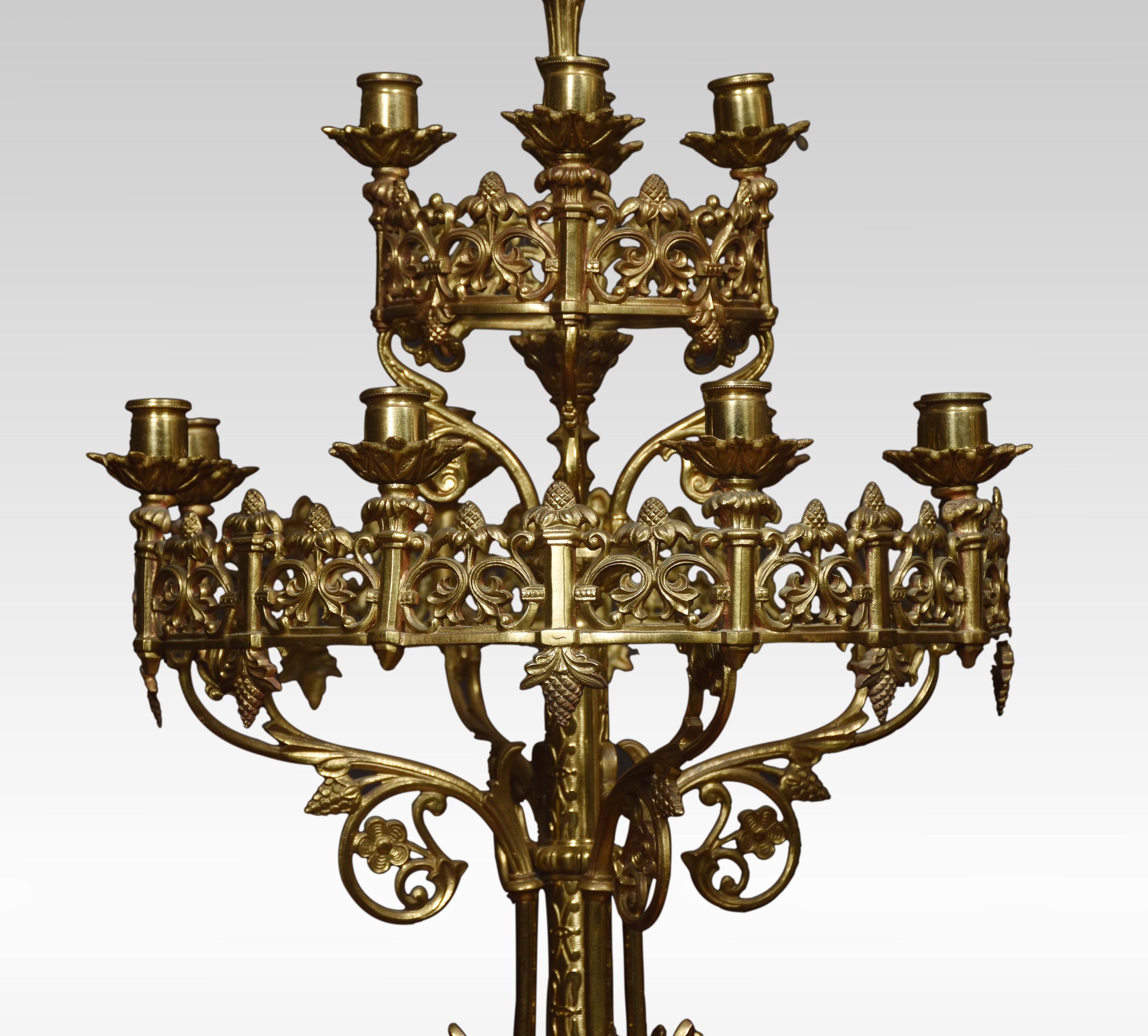 Pair of large 19th Century Gothic revival brass candelabras, the pierced foliated decorated frames with thirteen candle holders raised up on turned stem terminating in paw feet.
Dimensions
Height 40.5 Inches
Width 16.5 Inches
Depth 16.5 Inches