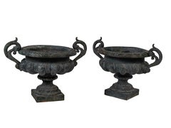 Pair of large 19th Century green painted Napoleon III urns with handles