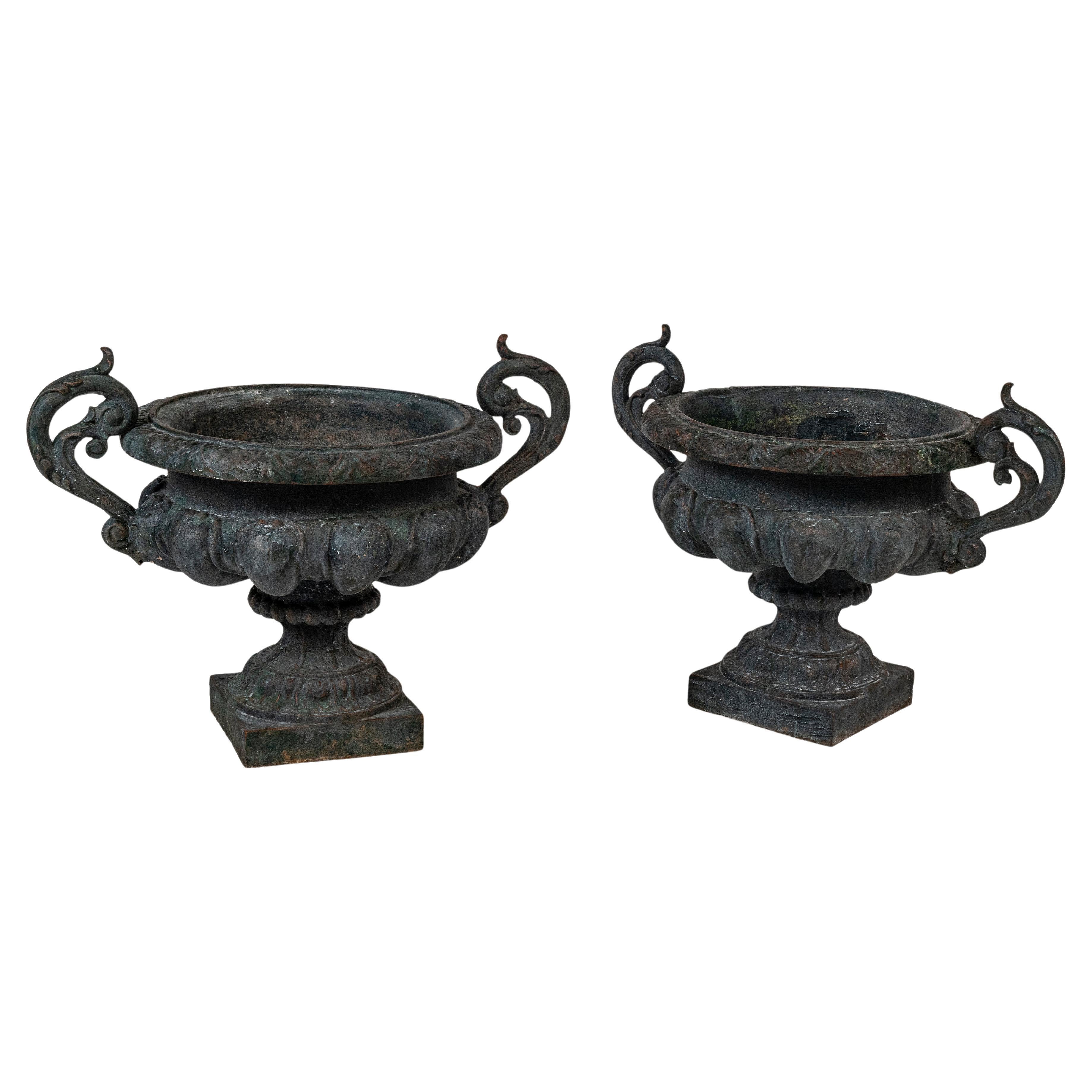 Pair of large 19th Century green painted Napoleon III urns with handles