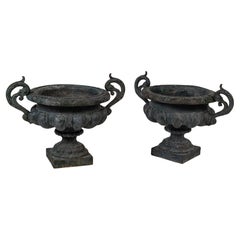 Pair of large 19th Century green painted Napoleon III urns with handles