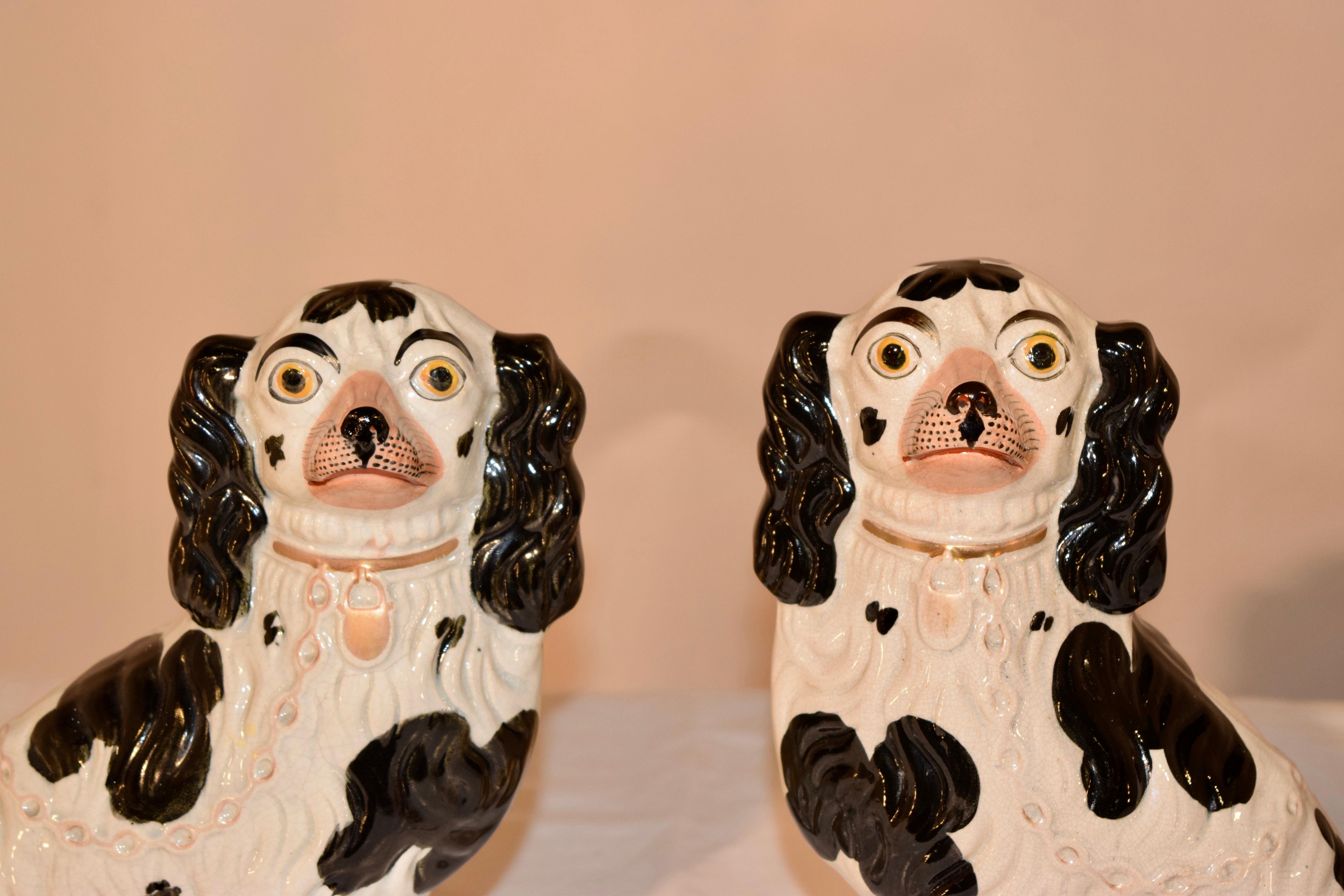 Pair of large 19th Century Staffordshire spaniels from England in lovely black and white coloring. They are wonderfully large sized and detailed molds.