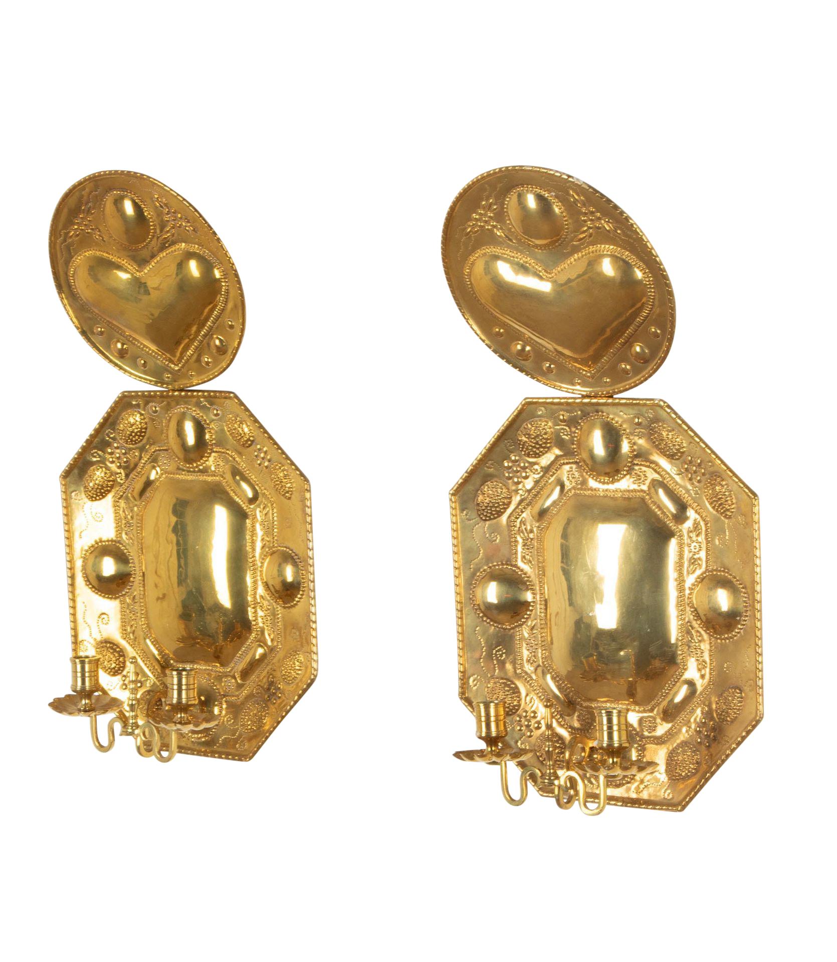 Pair of large 19th Century Swedish wall sconces.
With heart design, made from pressed brass.
Circa 1800.
