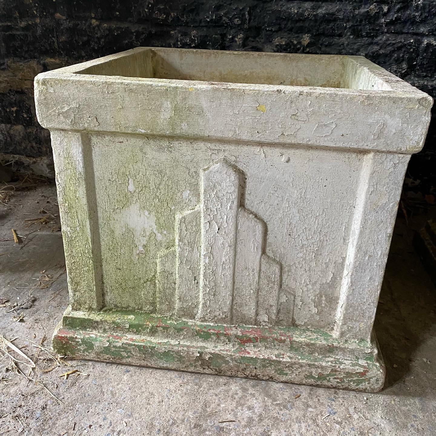 Pair of large French Art Deco composite cement stone geometric garden planters of square form, circa early 20th century. Pale flaky paint whitewash surface. 

These were sourced in the South of France, the sides feature typical Art Deco fan