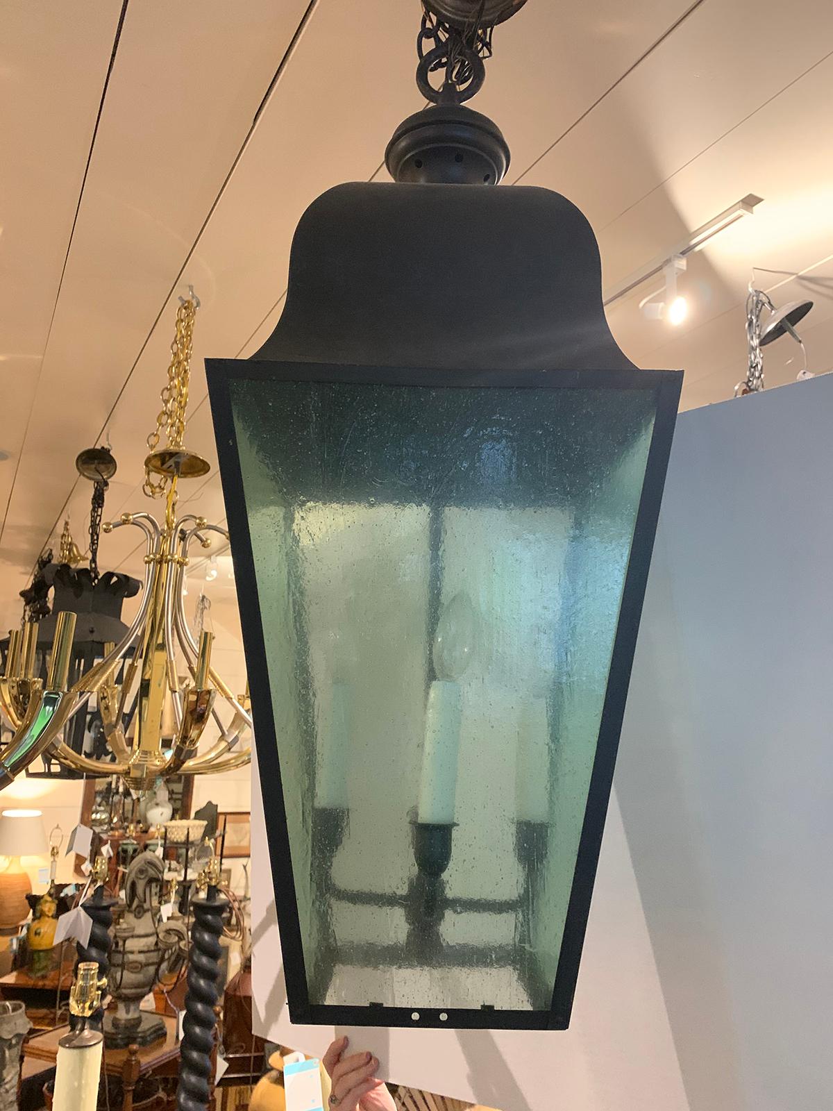 Pair of large 20th century black iron four-light lanterns with tinted glass
New wiring.