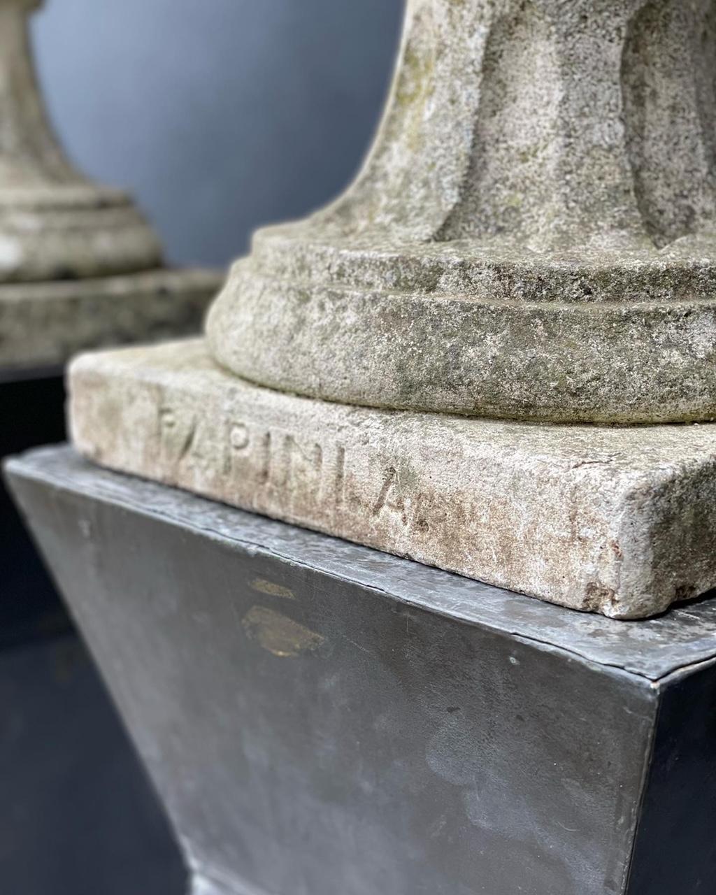 A very elegent pair of large scale, heavy cast stone acorn finials, one of the finials is stamped.

Minor loss on the base of one finial.
Width and depth dimension is taken from the base of finial.

The finials have a beautiful patina which can