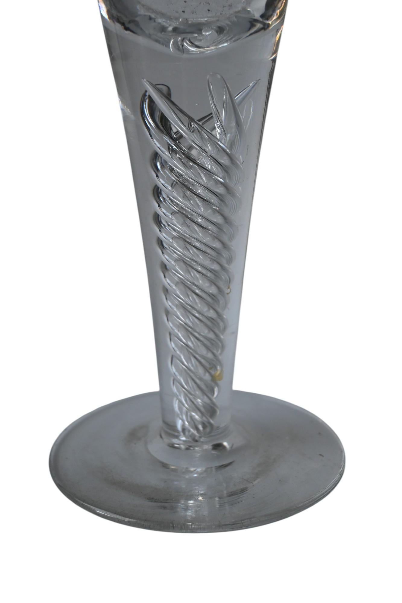 A pair of large 19th century double twist friendship/wedding glasses, richly engraved and decorated with an air twist foot. 
Leadglass , so probably British
Perfect condition.
Polished pontil mark in the base.
Height each 28 cm, Base diameter 10 cm.
