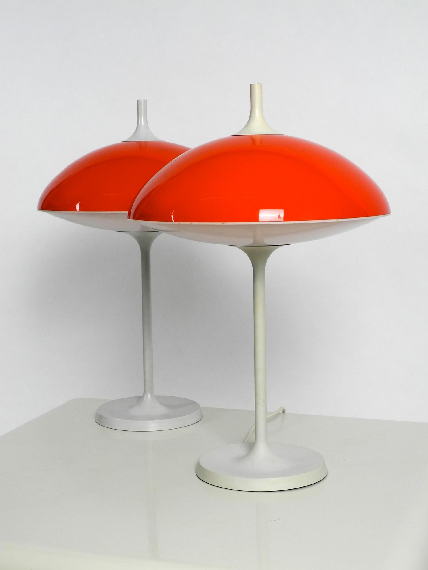 Pair of exceptional large 1960s Temde table lamp.
Made in Switzerland. Great Minimalist Pop Art Space Age design.
Foot and neck made of heavy metal painted white.
Shade made of two parts, top in red below white.
Very nice pleasant glare-free