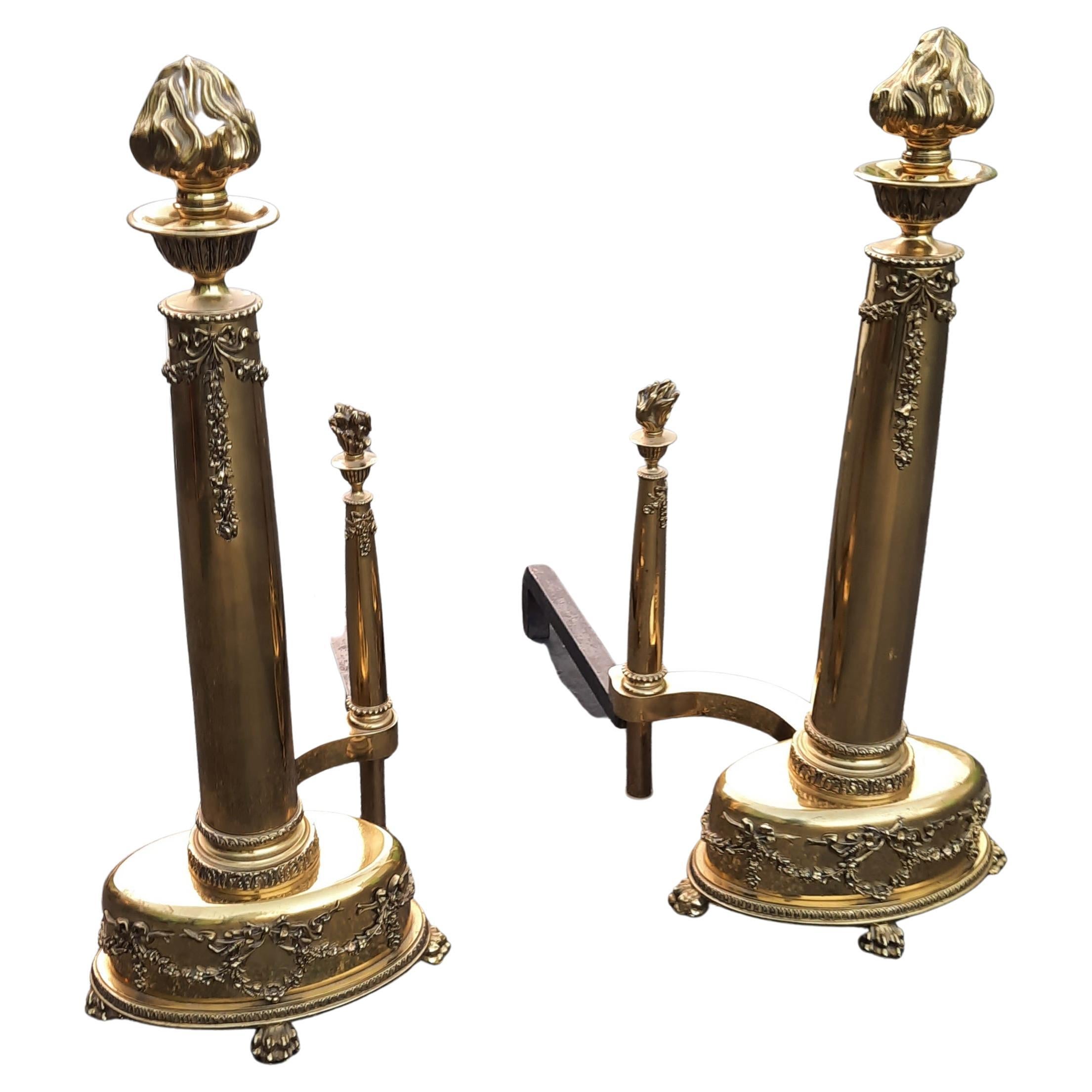 Amazingly decorated pair of large American Federal style brass ornate andirons.
This is very heavy and in polished brass ornate with carved brass flowers in the base, near the top and topped by a brass flame bouquet.
Very good vintage