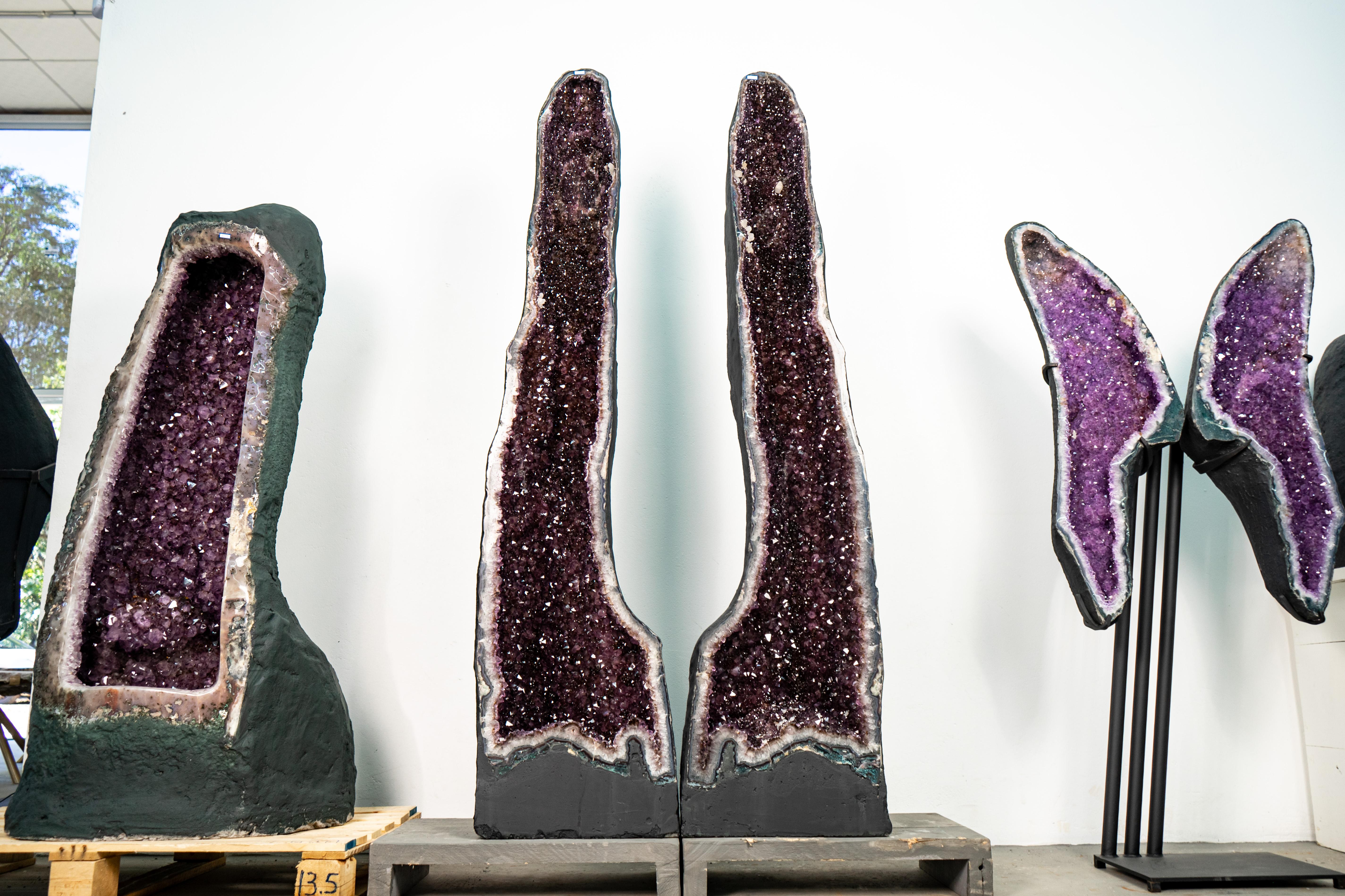 Stunning Pair of Tall Amethyst Cathedral Geodes – Sparkling Lavender Crystals with Rare Calcite & Goethite Inclusions

▫️ Description

This exceptional pair of tall, bookmatched amethyst cathedral geodes stands tall in an elegant, upright formation,