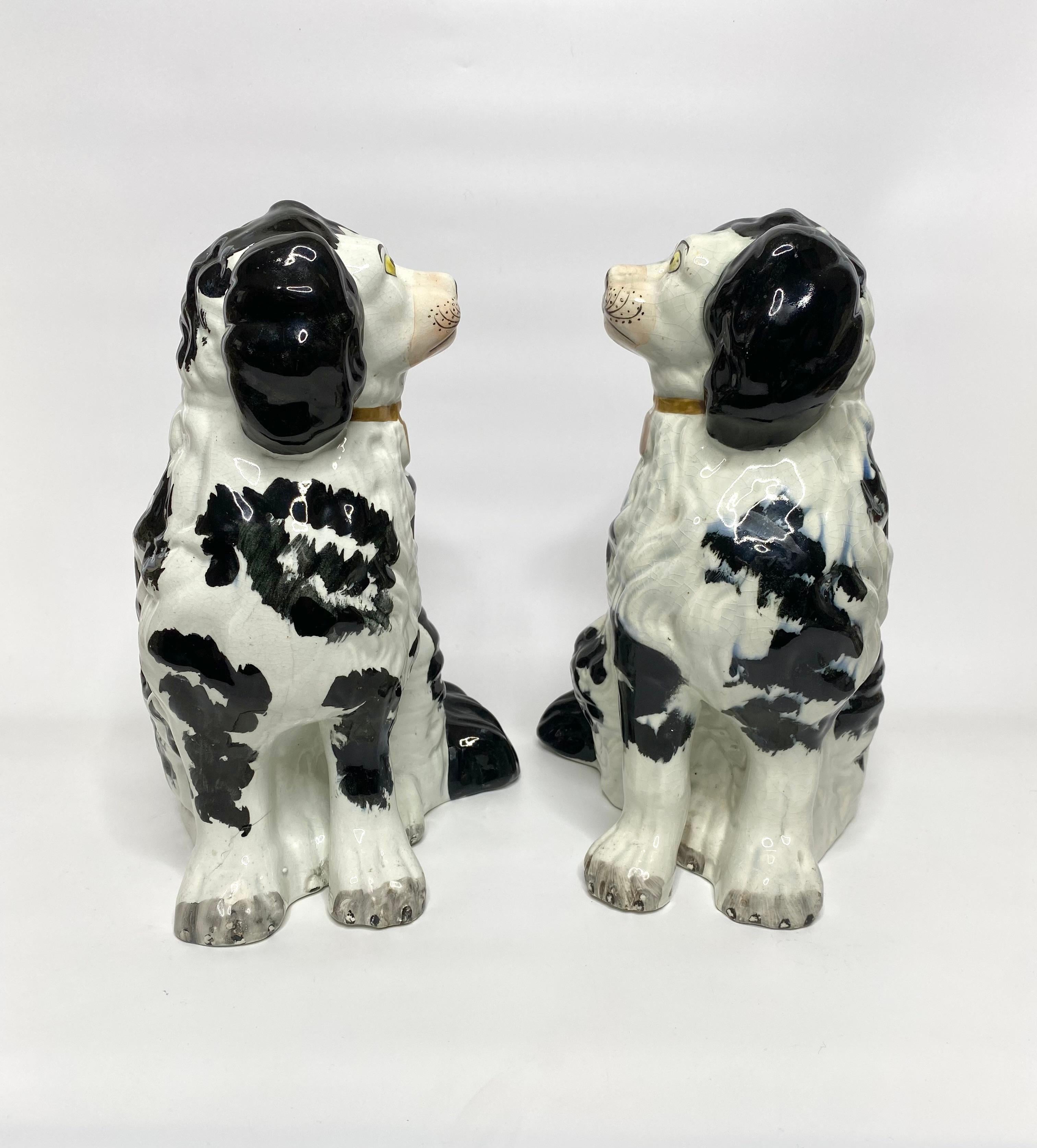 Fired Pair of large and rare Staffordshire Spaniels, c. 1840.