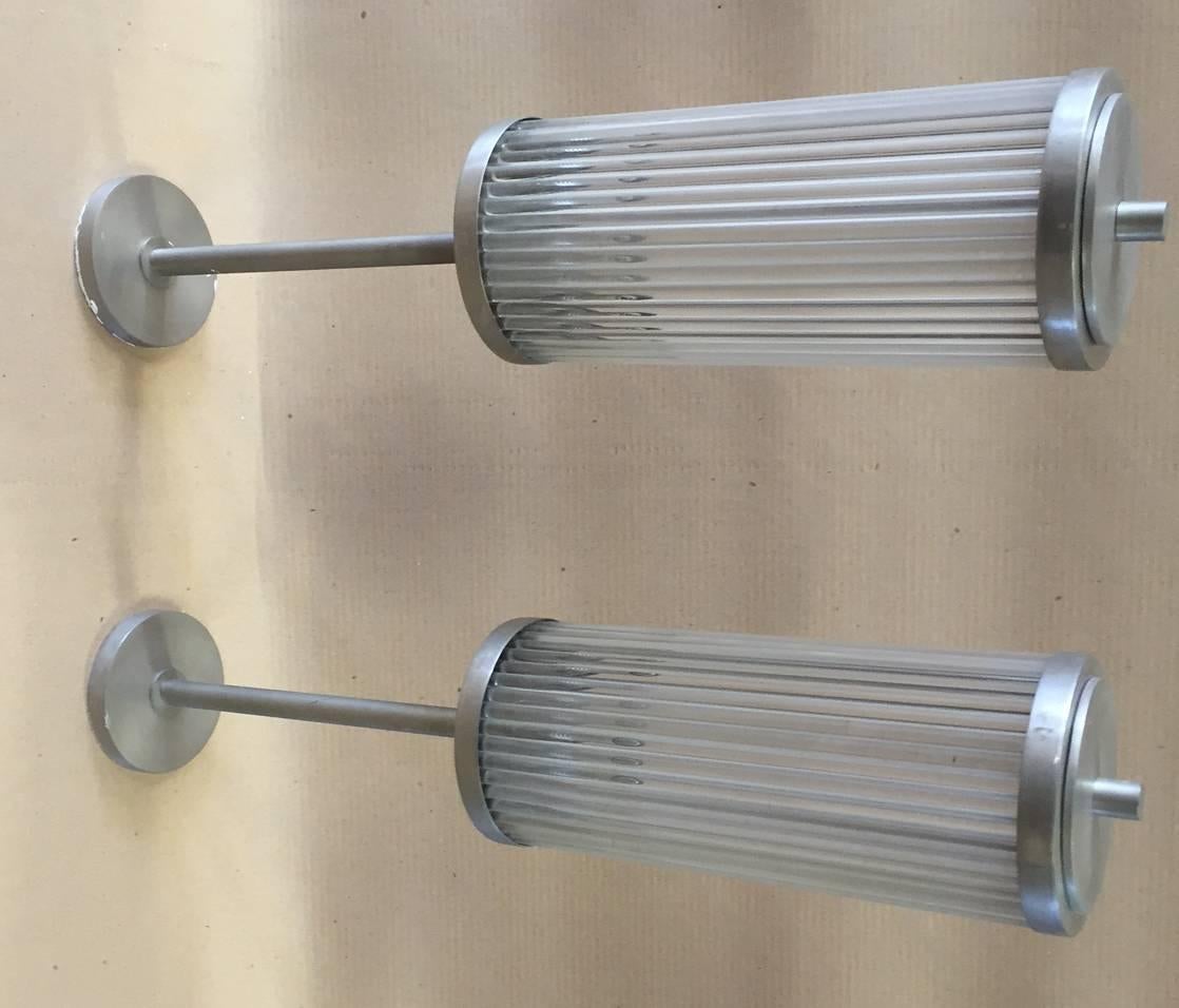 Pair of large nickel-plated brass sconces with cylindrical glasses.
Made in Italy, circa 1960.