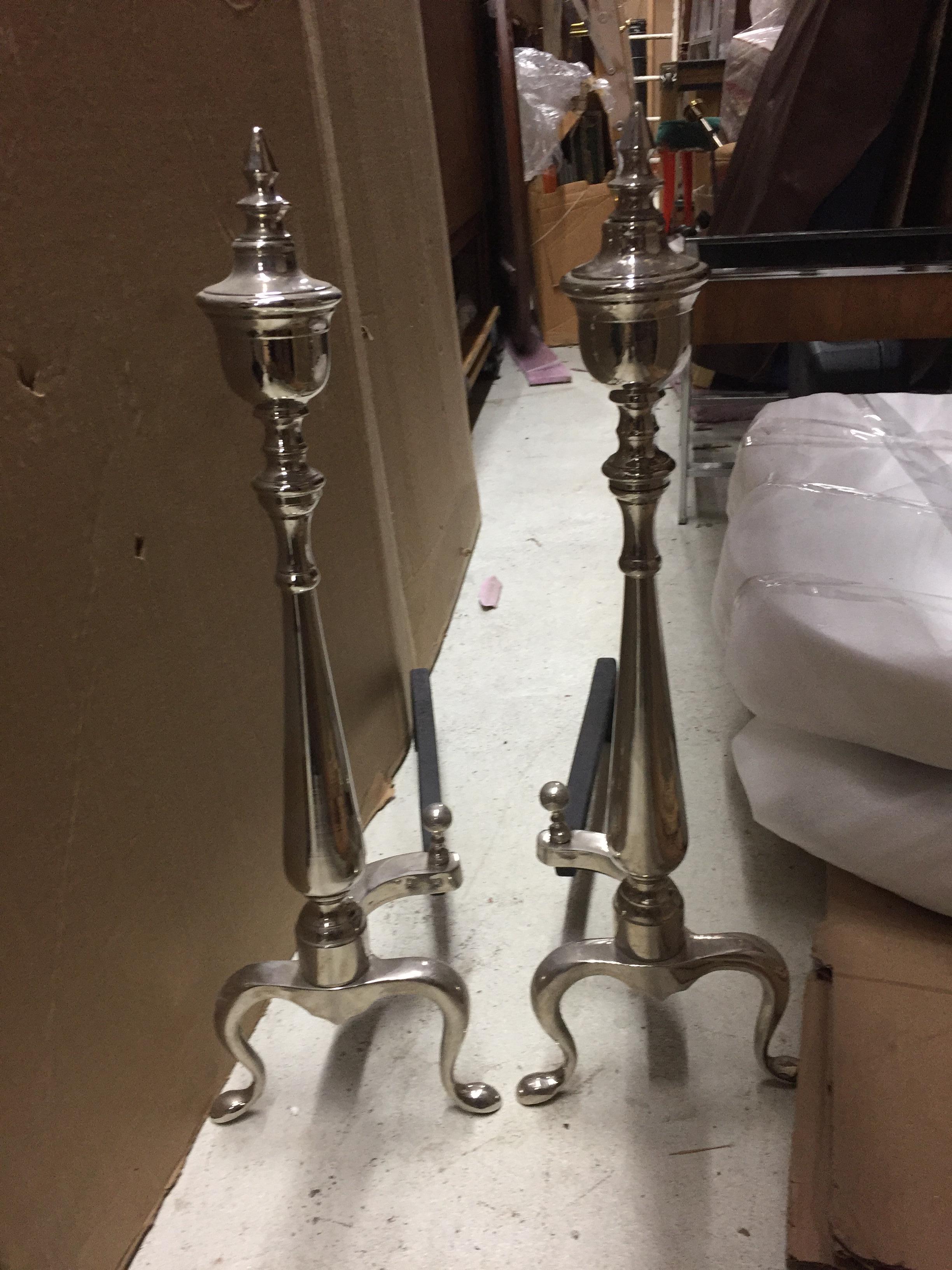 Satin brass, brass or nickel pair of large andirons with Chippendale ball and claw feet. Please see our large selection of Andirons and fire place tools or accessories.