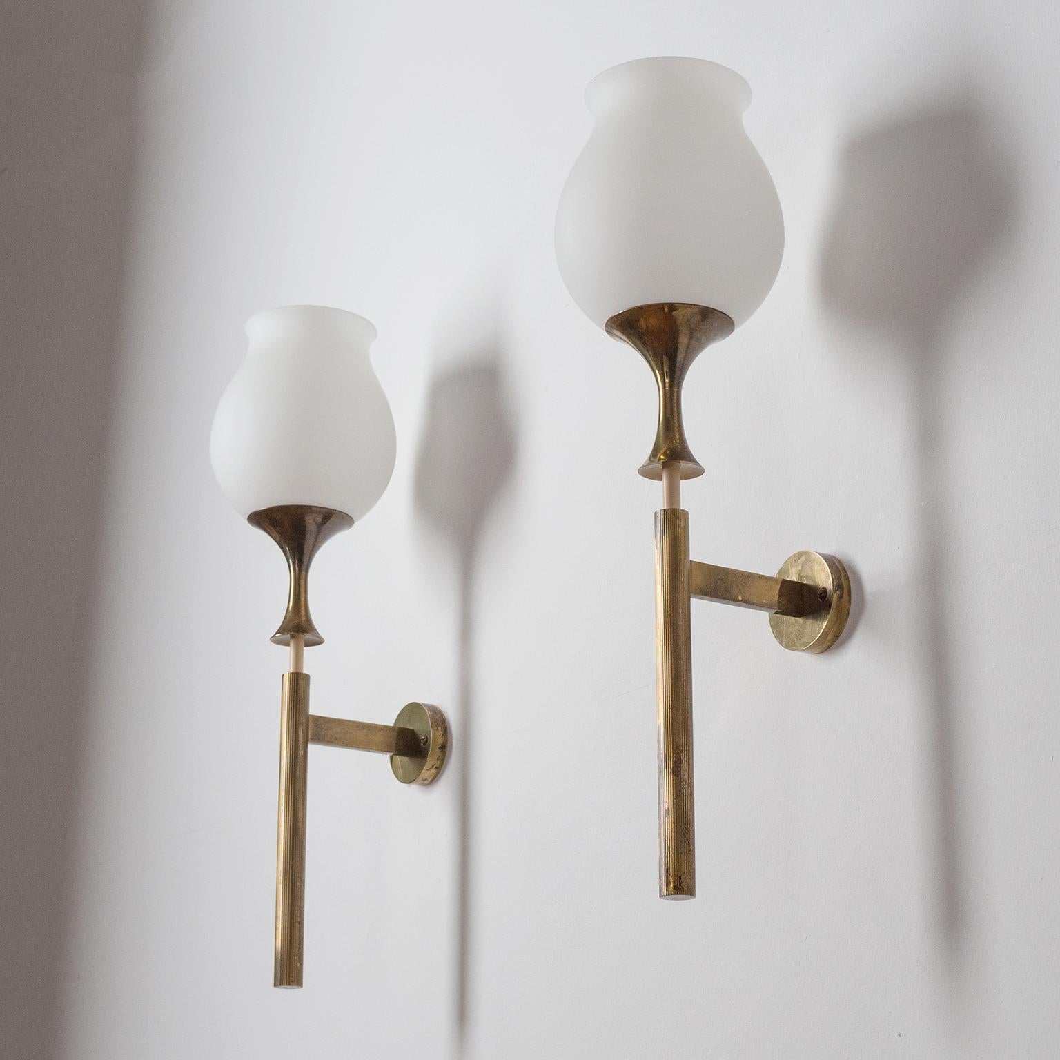 Rare pair of large modernist torch-style wall lights designed by Angelo Lelii for Arredoluce in 1956. All brass hardware with sensuous tulip-shaped blown satin glass diffusers. Nice original condition with patina on the brass. One original brass and