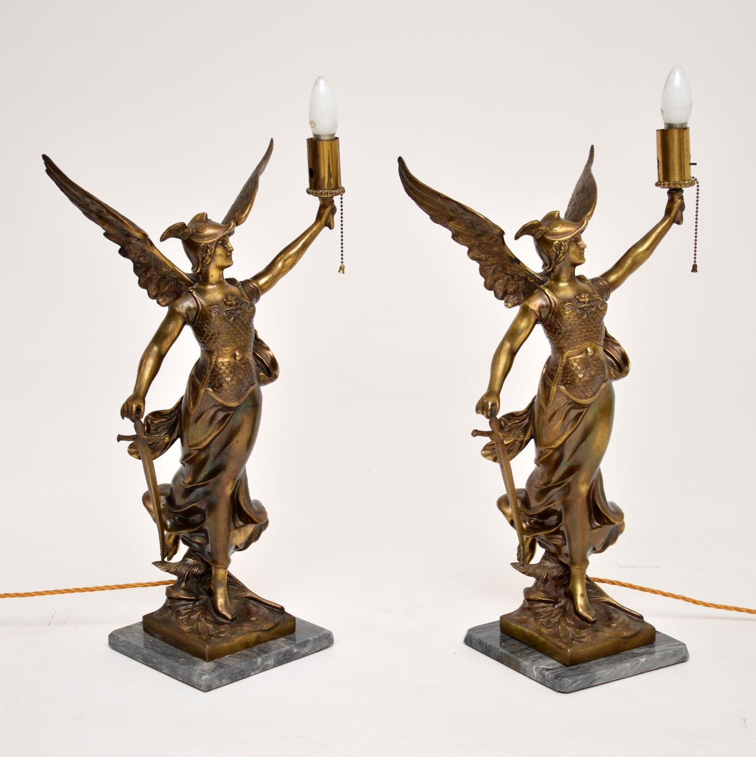 A monumental pair of bronze table lamps on marble bases, depicting the ancient Greek goddess Athena. These were made in England and date from around the 1920’s.

They are very large and extremely impressive, the quality is fantastic. Each lamp is
