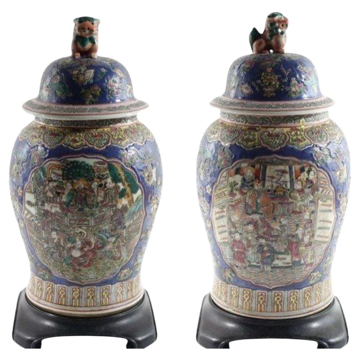 Pair of Large Antique Chinese Porcelain Urns with Lion Lid and Wood Stand For Sale