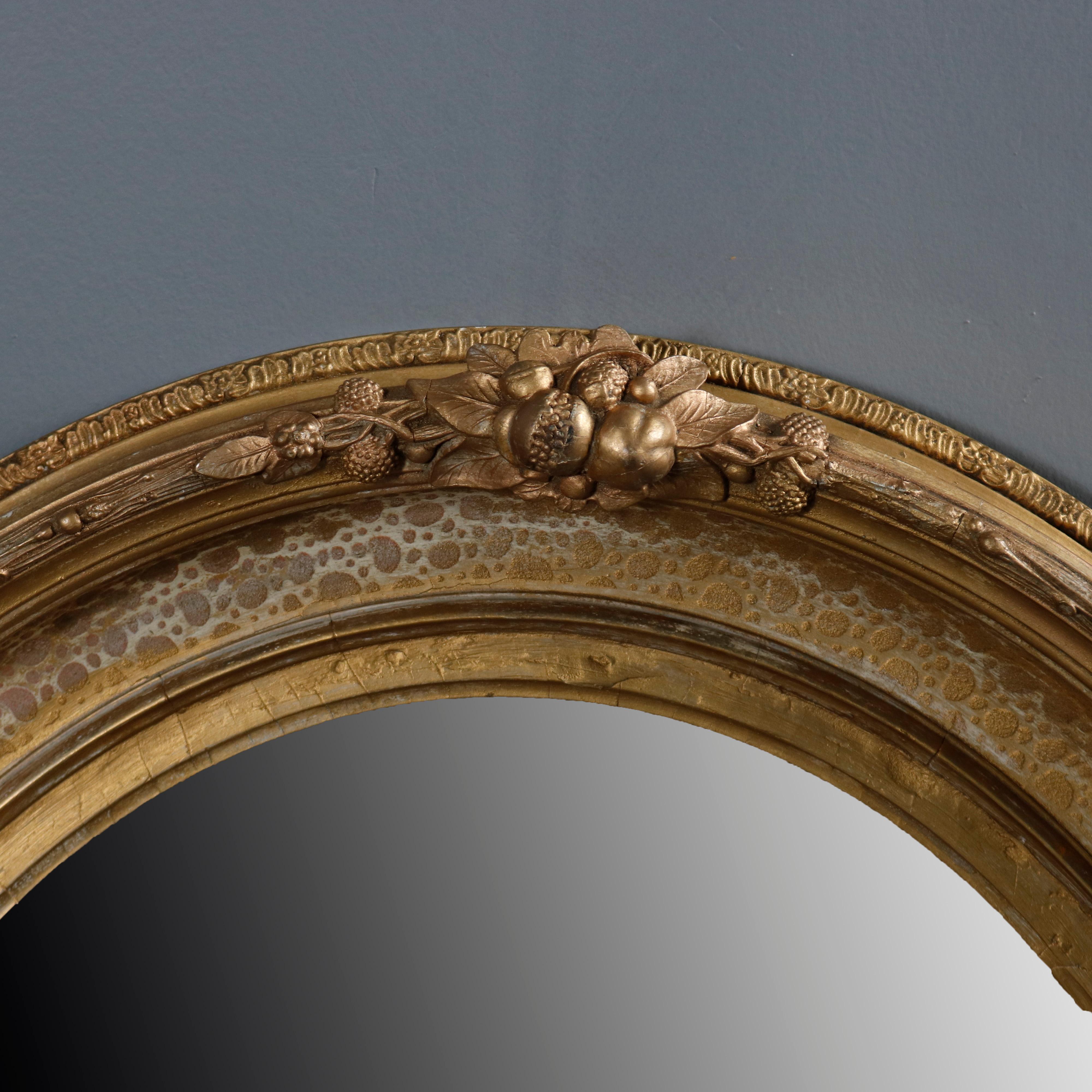 Pair of Large and Antique French Louis XIV Floral Giltwood Oval Wall Mirrors In Good Condition In Big Flats, NY