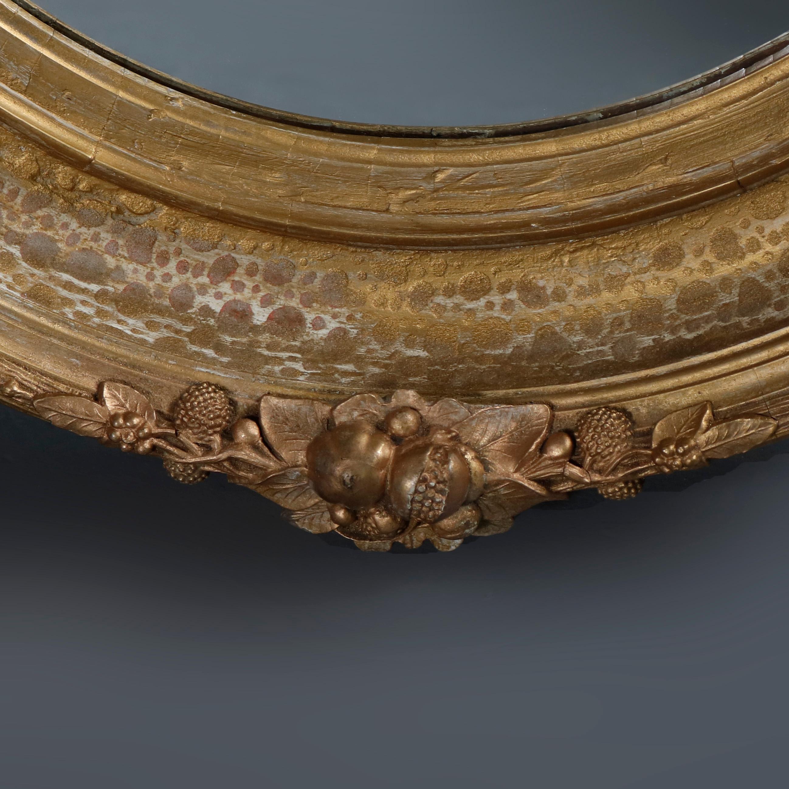 Pair of Large and Antique French Louis XIV Floral Giltwood Oval Wall Mirrors 1