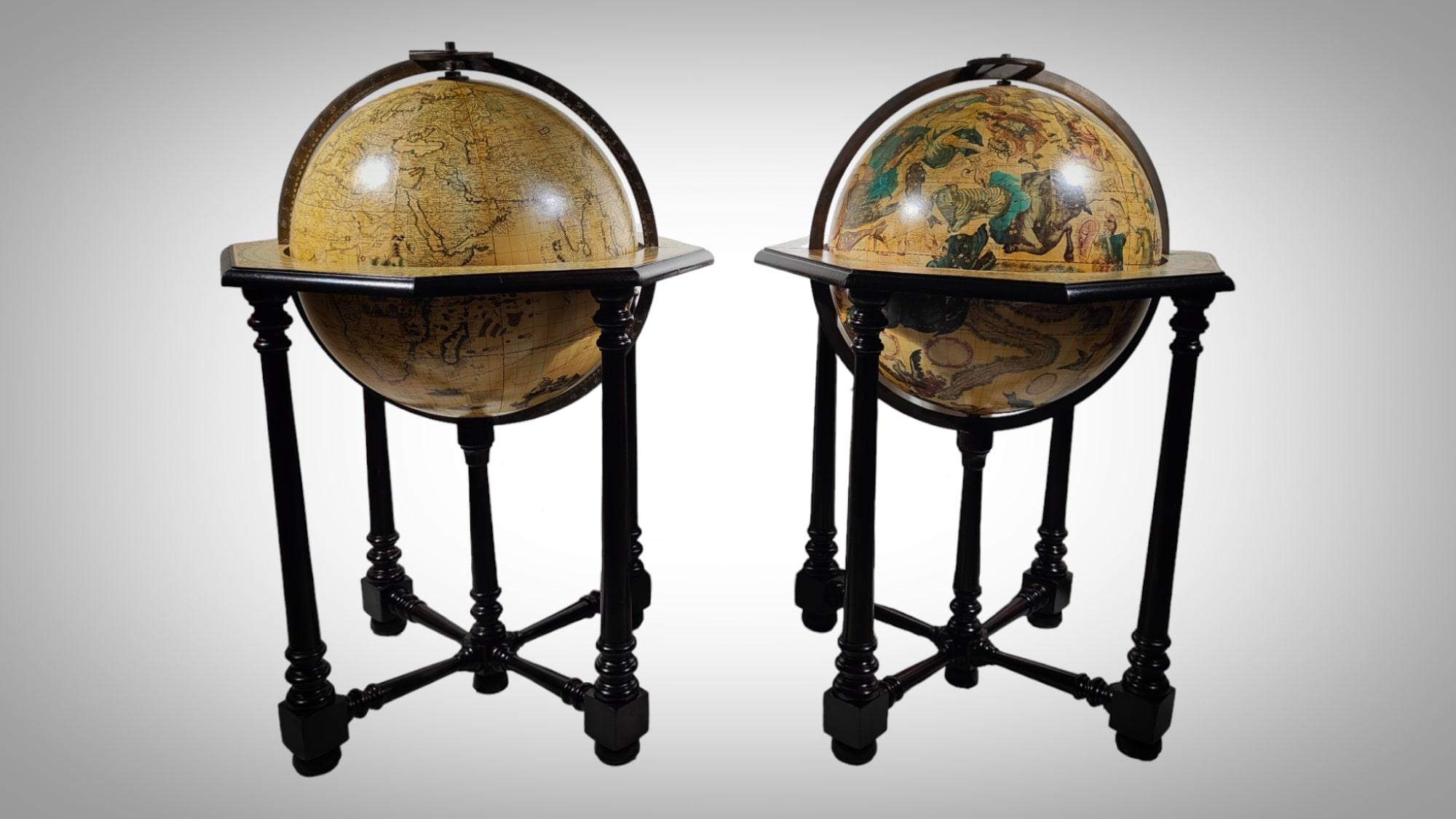 Pair Of Large Antique Italian Globes 
Large pair of terrestrial and celestial globes from Italy 1940s. The globes are in good condition except for normal use and the passage of time. The base is made of ebonised wood. The meridian circles and hands