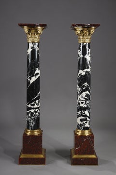 Pair of Large Antique Marble Columns with gilded bronze capitals