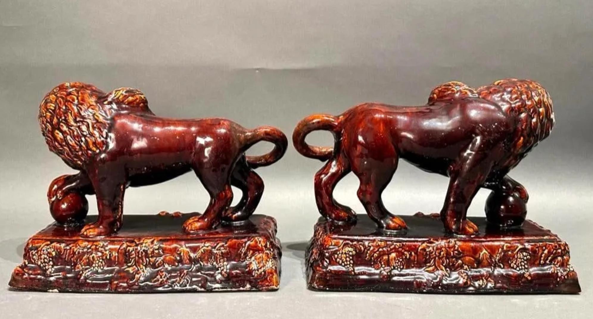 Pair of Large Antique Rockingham Pottery Medici Lions c.1840. Each featuring an unusual red undertone to the classic brown Rockingham finish.