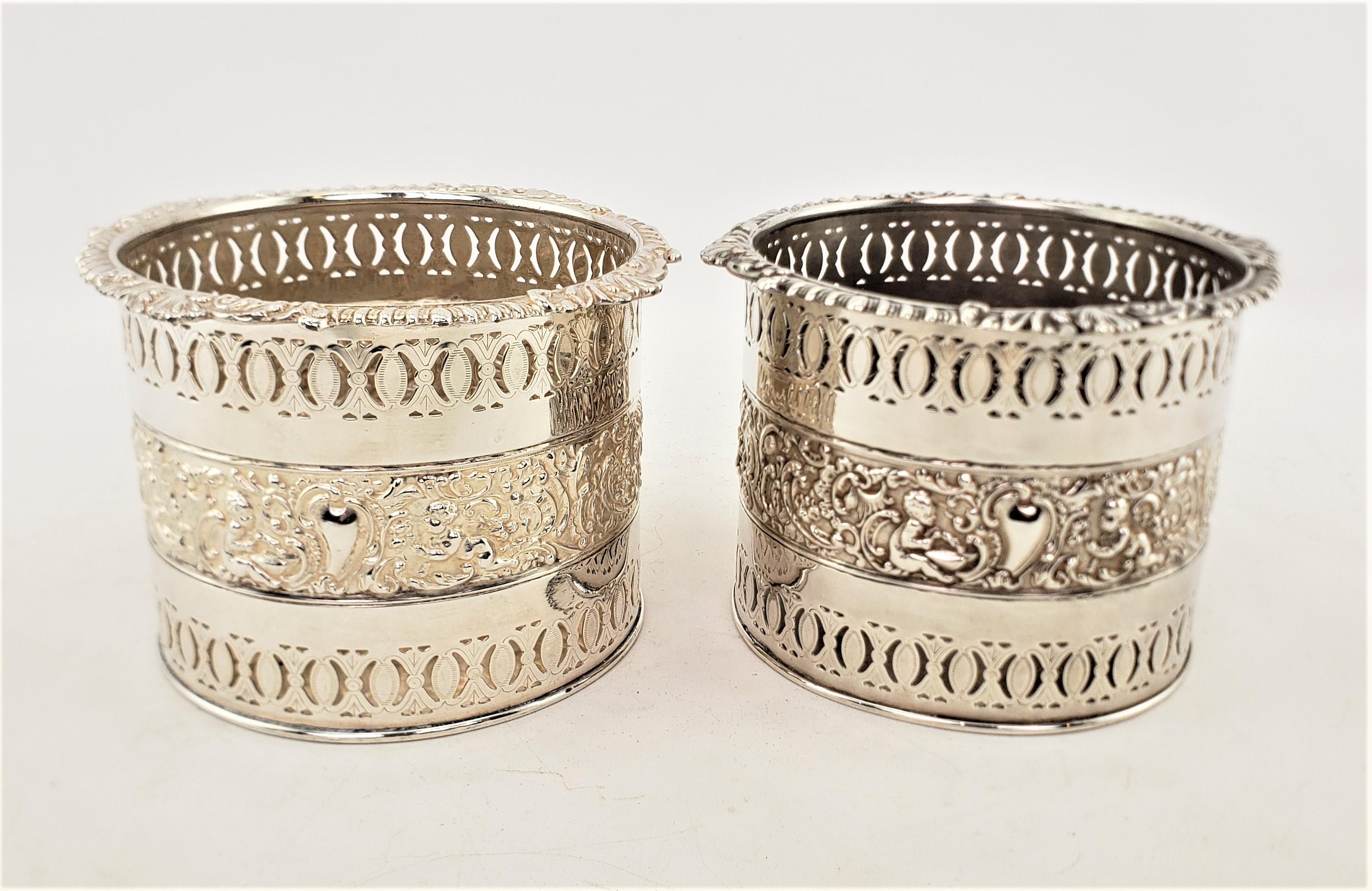 20th Century Pair of Large Antique Silver Plated Bottle Coasters with Repousse Decoration For Sale