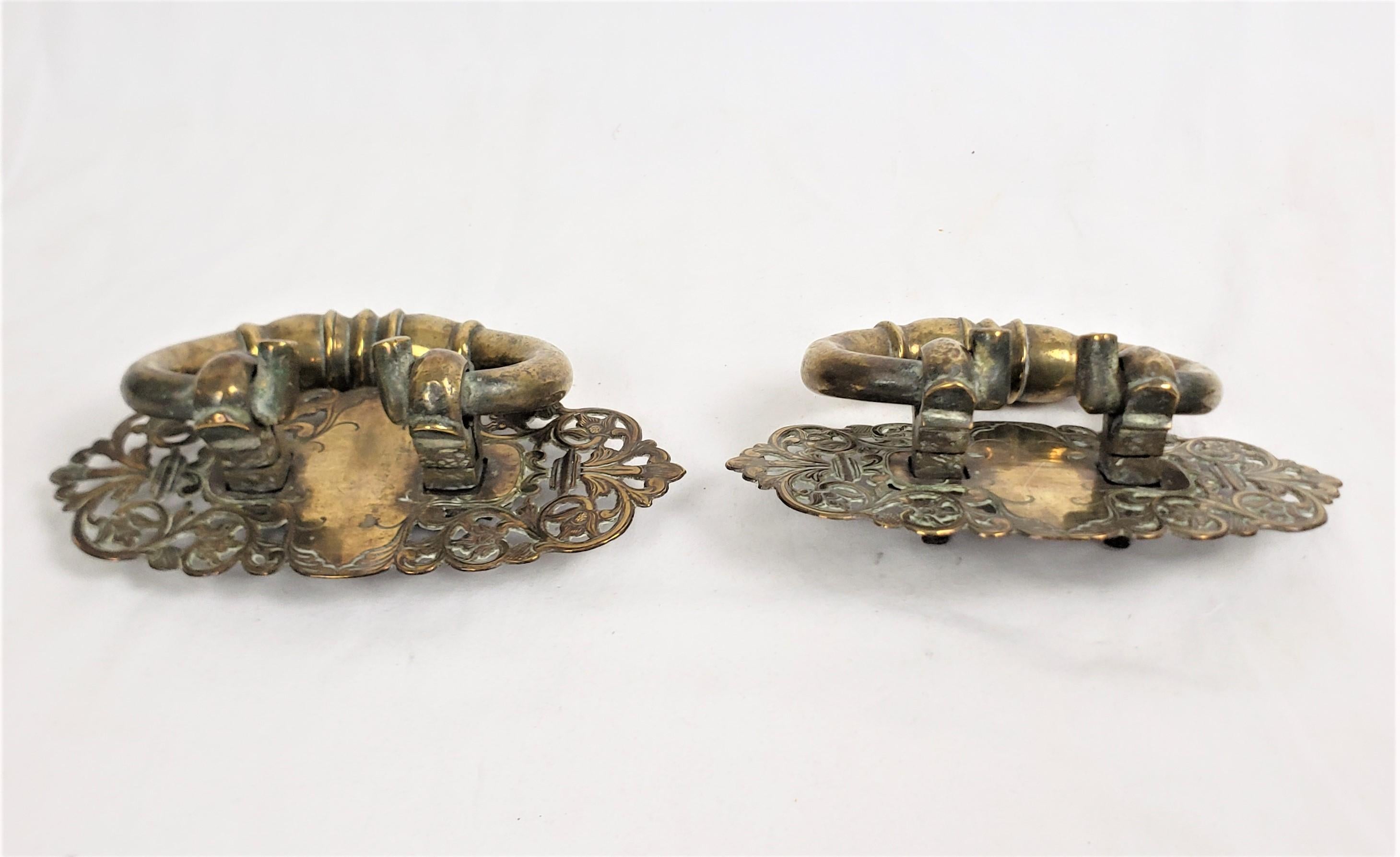 Machine-Made Pair of Large Antique Solid Brass Handles with Pierced Floral Back Plates For Sale