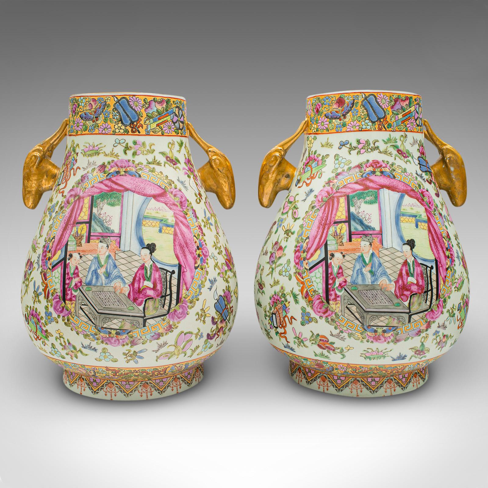 This is a pair of large antique vases. A Chinese, ceramic baluster urn with Famille Rose pattern, dating to the late Victorian period, circa 1900.

Striking pair of antique vases with excellent colour and proportion
Displaying a desirable aged