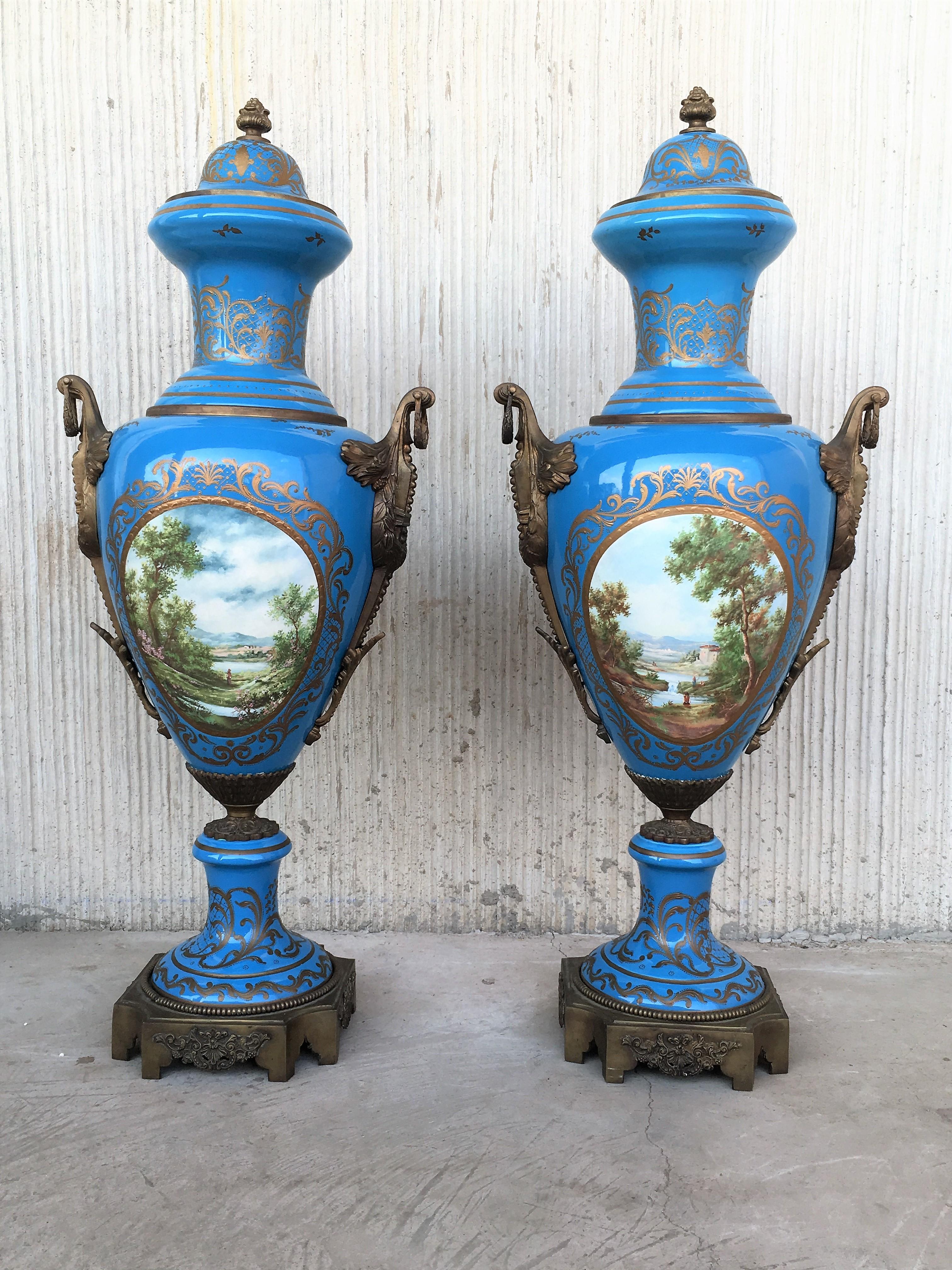 A pair of large 19th century French Sevres ormolu-mounted and painted vases.

Each in baluster form with large ormolu mounts. The body finely painted depicting a typical landscape. The reverse painted with religious and mythological scenes