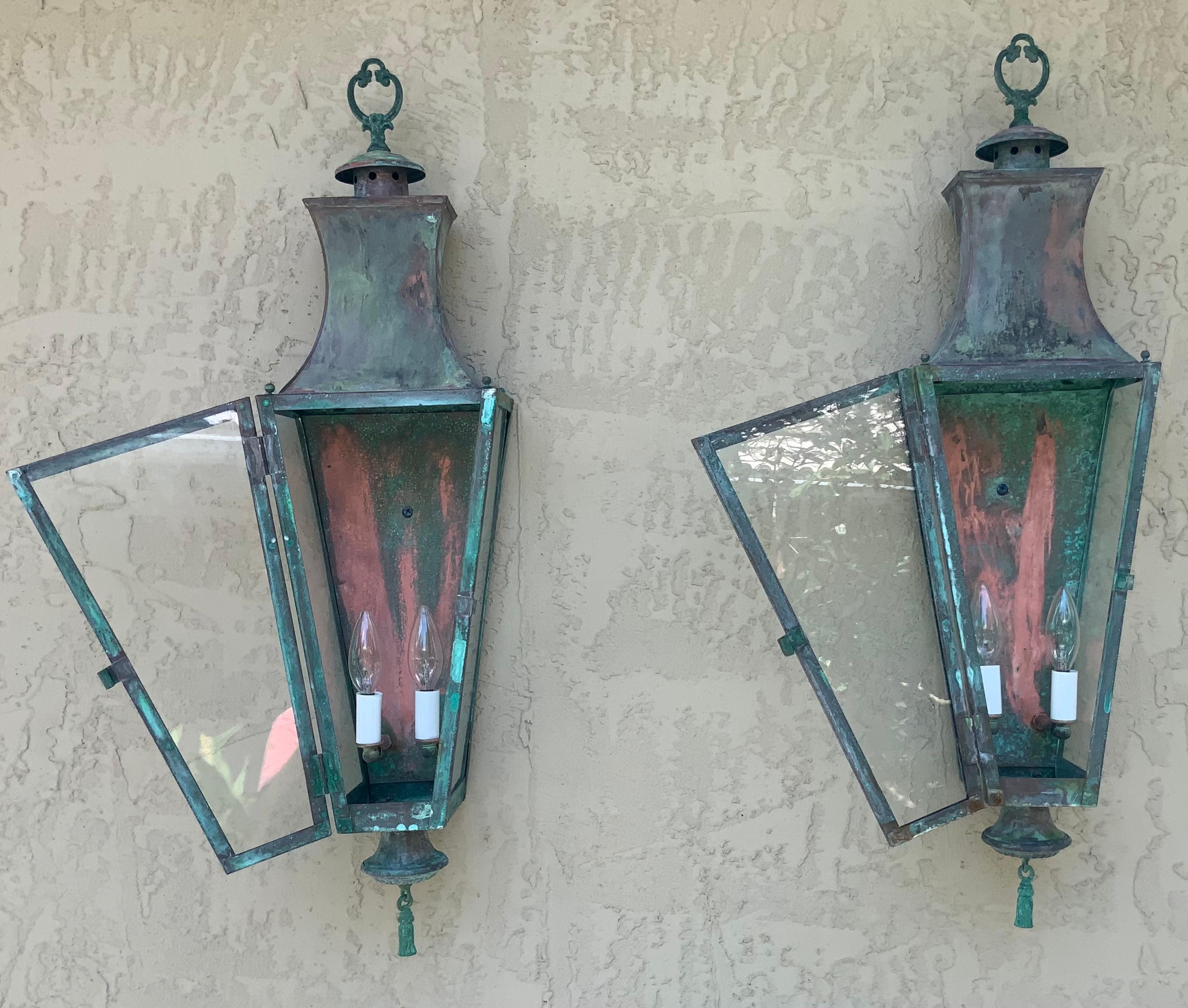 Pair of vintage wall lantern or wall sconces, made of solid brass beautifully weathered patina, two 60/watt lights each lantern,
Very decorative pair.