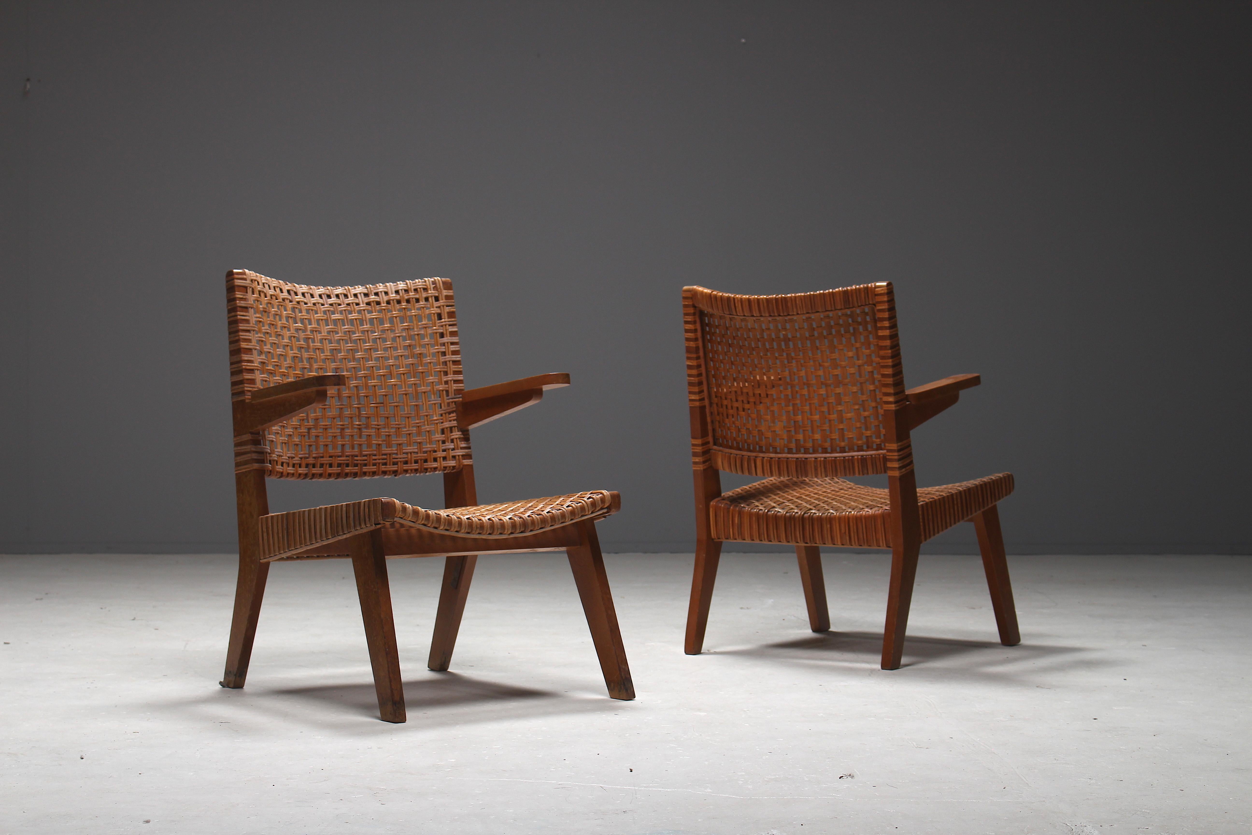 A very rare pair of arm chairs by Pierre Jeanneret from the mid-1950s Swiss period. These chairs are part of a low scale production serie. This pair of chairs is very rare, more common are the chairs Jeanneret specially made for the apartment of
