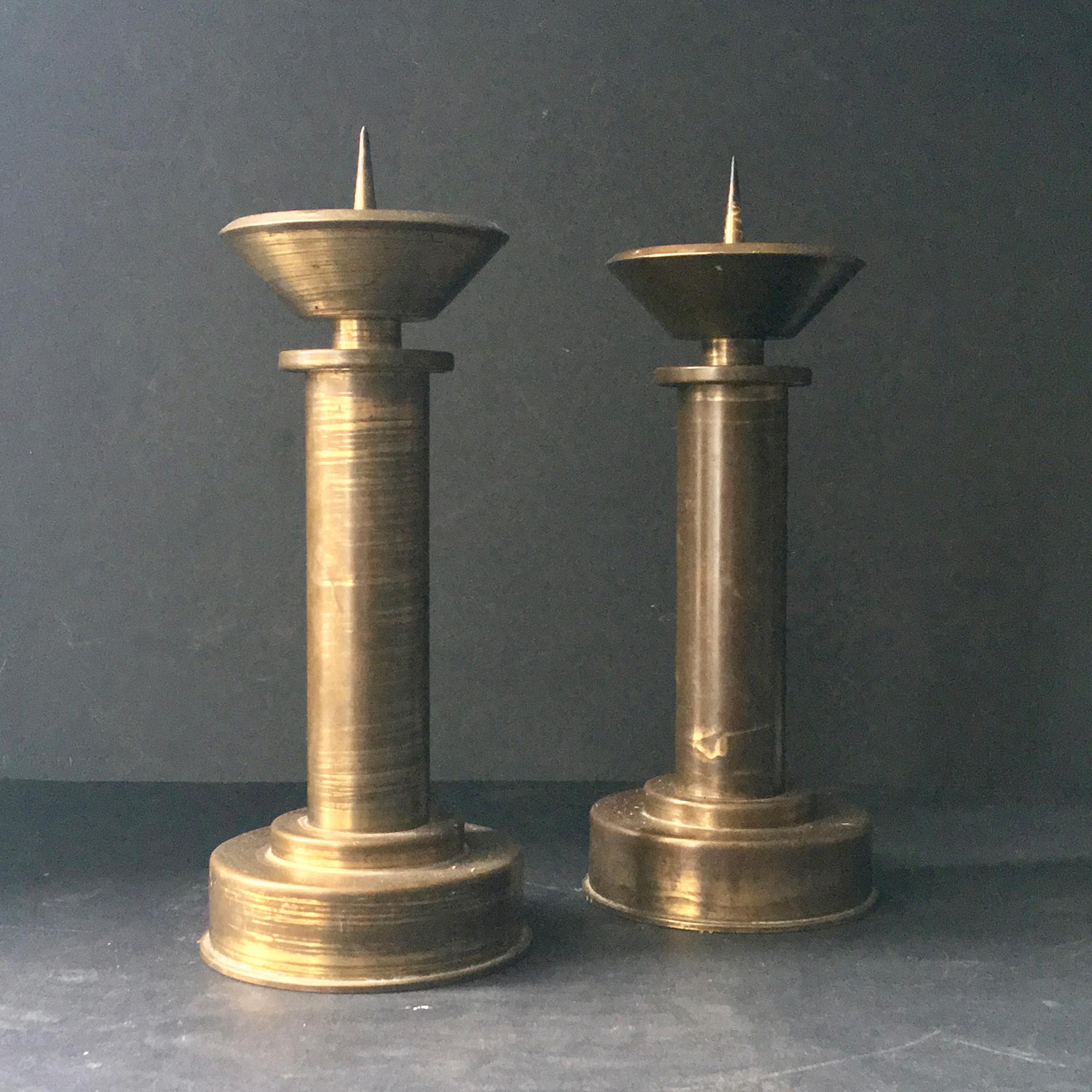 Pair of large Art Deco candlesticks in brass or bronze. German or Austrian, early to mid-20th century, probably church candlesticks.

Good vintage condition with nice aged patina and some signs of wear including minor dents, scratches and traces