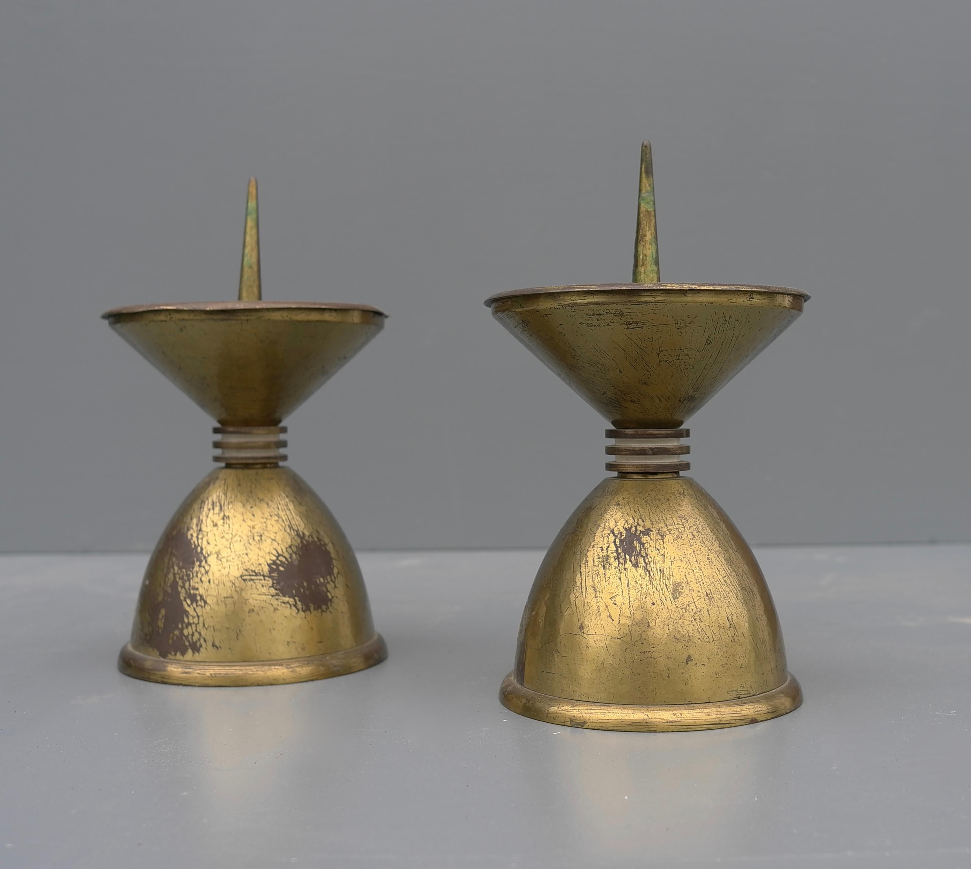 Pair of large Art Deco bronze and brass candle holders, France, 1930's.