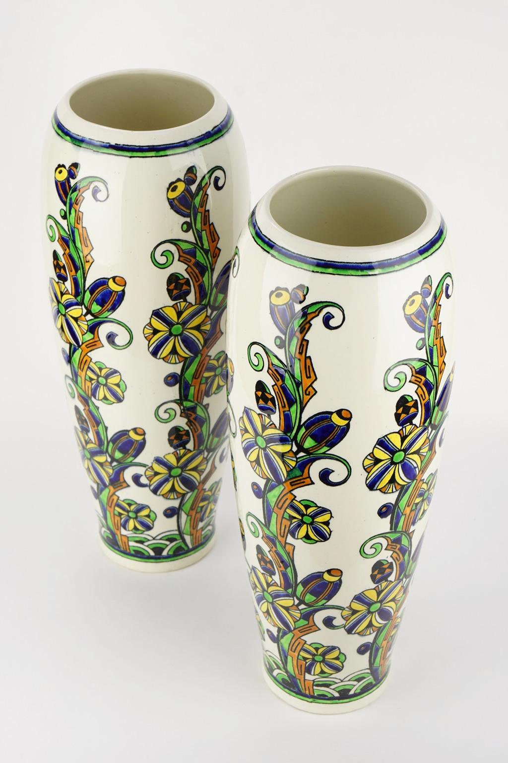 Pair of large Art Deco floral vases.
Material: Enamel on earthenware.
Size: Height 44 cm., diameter base 10 cm., diameter top 12 cm.
Very good condition.