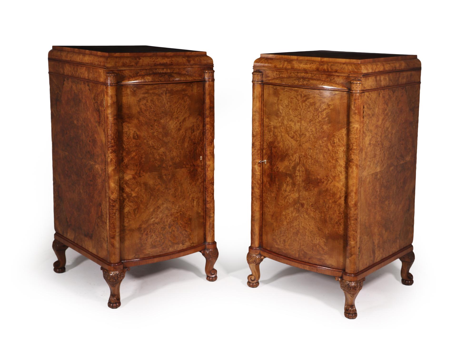 A very large pair of cabinets, please check dimensions below, English made in the Art Deco period c1930 these cabinets are exceptional quality with great attention to detail gently bow fronted with columns either side of the door and standing on a