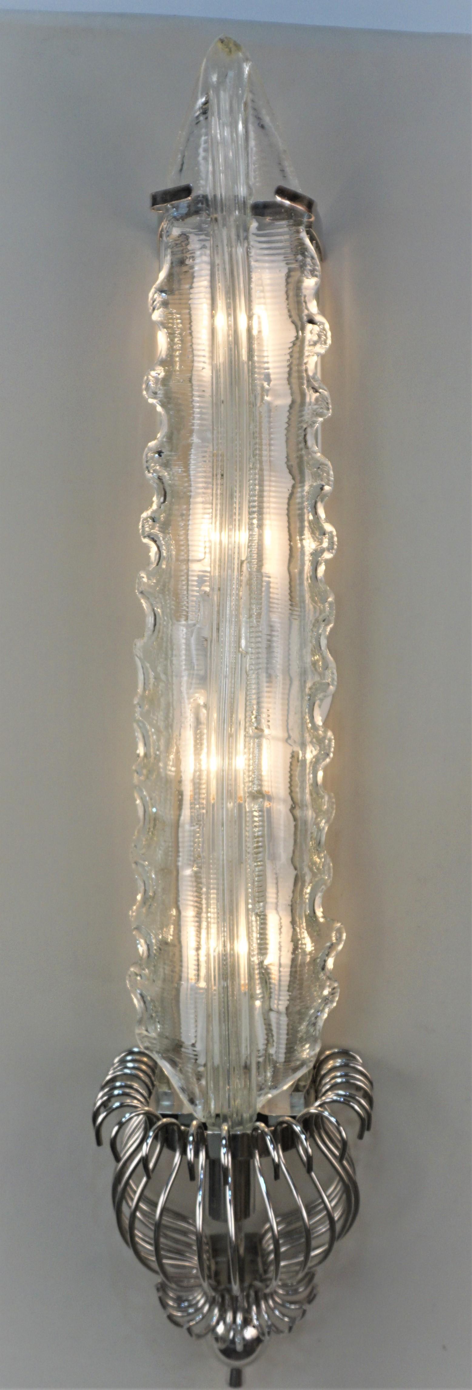 Pair of large center leaf blown glass, glass rods on the sides with nickel on bronze hardware wall sconces.