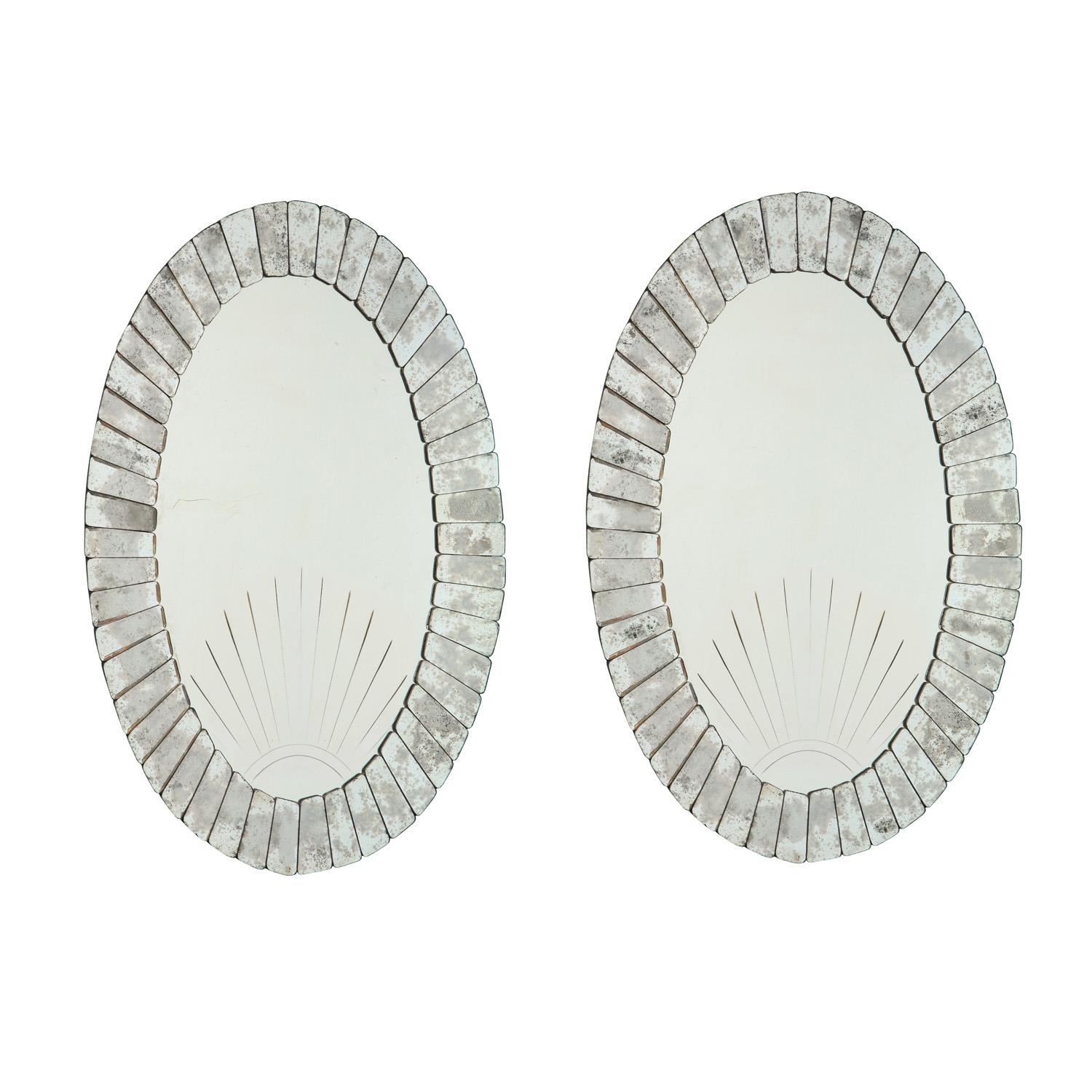 Pair of superb large artisan etched Art Deco sunset mirrors with antiqued mirror starburst pattern around center mirror, Venetian 1930's. The Venetians did many tributes to the spectacular sunsets over the lagoons. This is a beautifully crafted pair