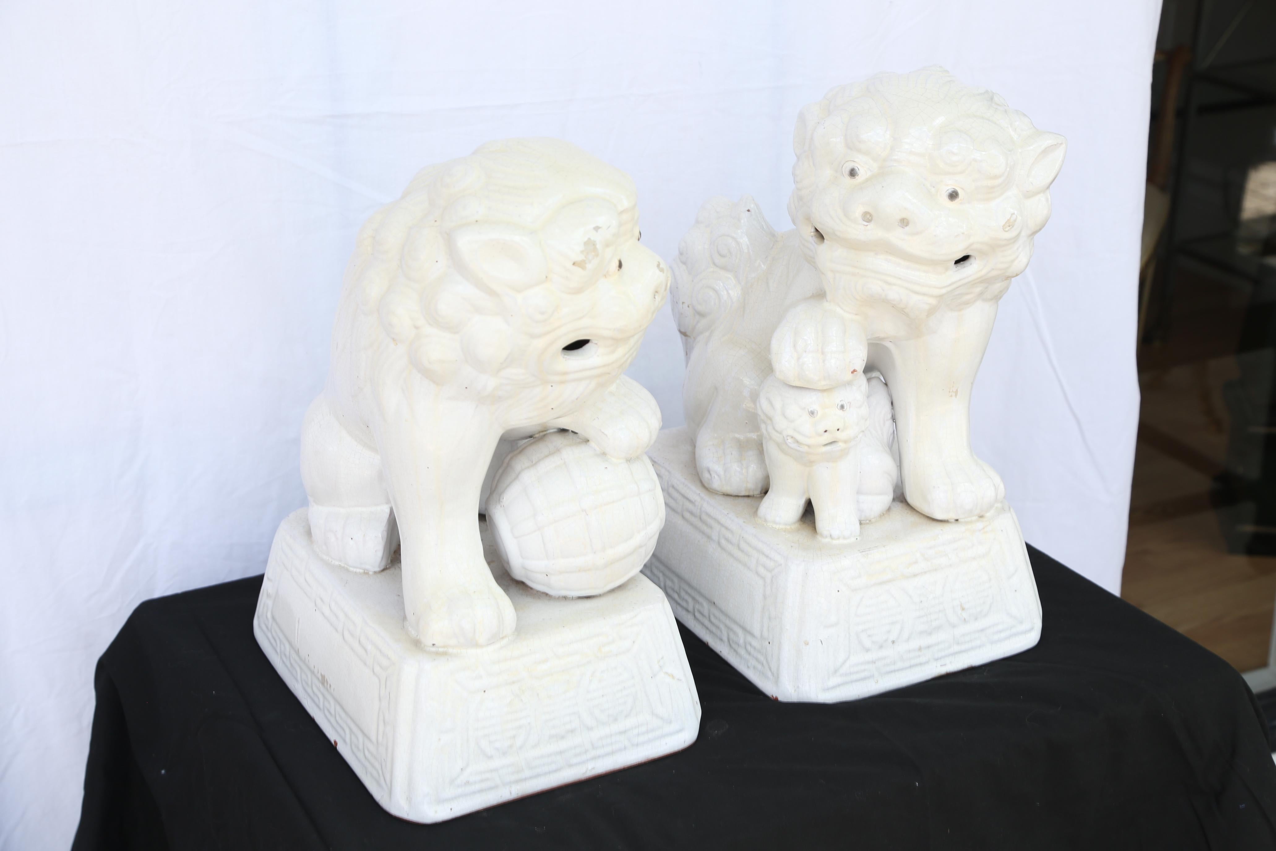Large pair of vintage Chinese white foo dogs.