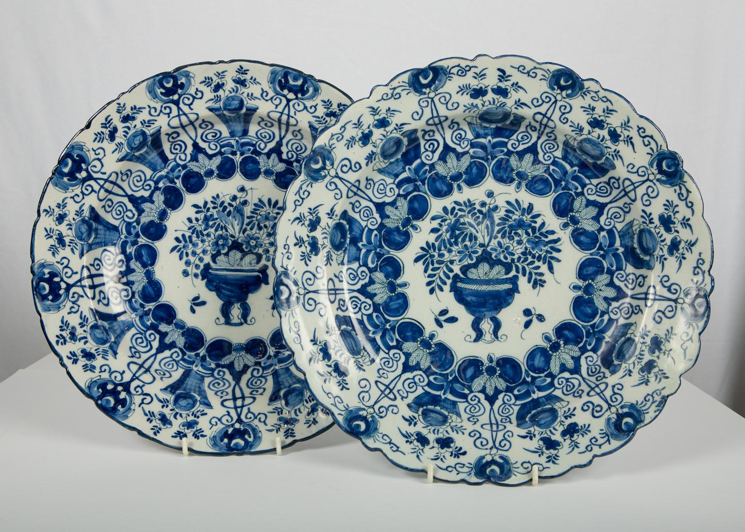 We are pleased to offer this pair of large blue and white Delft chargers made by and with the mark of 